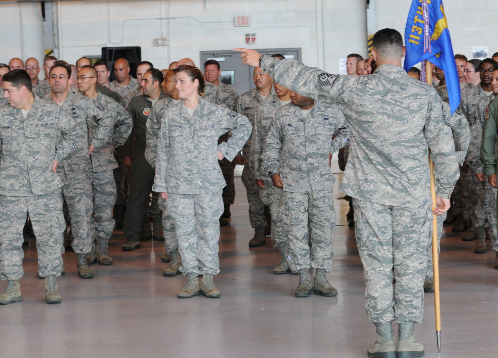 Master Sgt. Elias Sepulveda, 113th Medical Group First Sergeant, directs the formation to 'dress right' during the 113th Wing Change of Command ceremony, Joint Base Andrews, Md. Brig. Gen. Marc H. Sasseville assumed command of the 113th Wing from Brig. Gen. Jeffrey Johnson, marking the end of General Johnson's 29-year career in the D.C. Air National Guard.  (U.S. Air Force photo/Tech Sgt. Craig Clapper)  