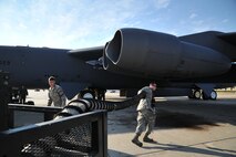 MINOT AIR FORCE BASE, N.D. – A crew chief from the 5th Aircraft Maintenance Squadron plugs an air cart into a B-52H Stratofortress prior to a mission here, Aug. 10. As part of Air Force Global Strike Command, crew chiefs work endlessly to preserve our nation’s security by providing combat-ready forces for nuclear deterrence and global strike operations.  (U.S. Air Force photo/Senior Airman Brittany Y. Auld) 