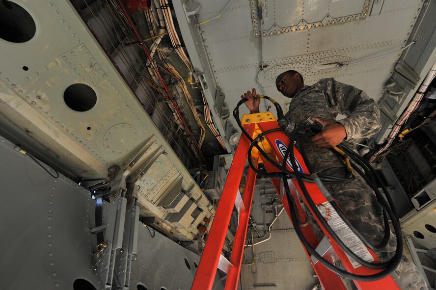 MINOT AIR FORCE BASE, N.D. -- Airman 1st Class Gavin Moses, 5th Aircraft Maintenance Squadron weapons load crew member installs a cable to perform an operational check on the internal conventional weapons system on a B-52H Stratofortress here, Aug. 10. As part of Air Force Global Strike Command, weapons loaders work endlessly to preserve our nation’s security by providing combat-ready forces for nuclear deterrence and global strike operations. (U.S. Air Force photo/Senior Airman Brittany Y. Auld) 