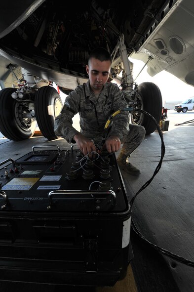 MINOT AIR FORCE BASE, N.D. -- Airman 1st Class Lucas Lamothe, 5th Aircraft Maintenance Squadron weapons load crew member uses a Multi User System Tester-Armament Next Generation that will perform a check on the internal conventional weapons system on a B-52H Stratofortress here, Aug. 10. As part of Air Force Global Strike Command, weapons loaders work endlessly to preserve our nation’s security by providing combat-ready forces for nuclear deterrence and global strike operations.  (U.S. Air Force photo/Senior Airman Brittany Y. Auld) 