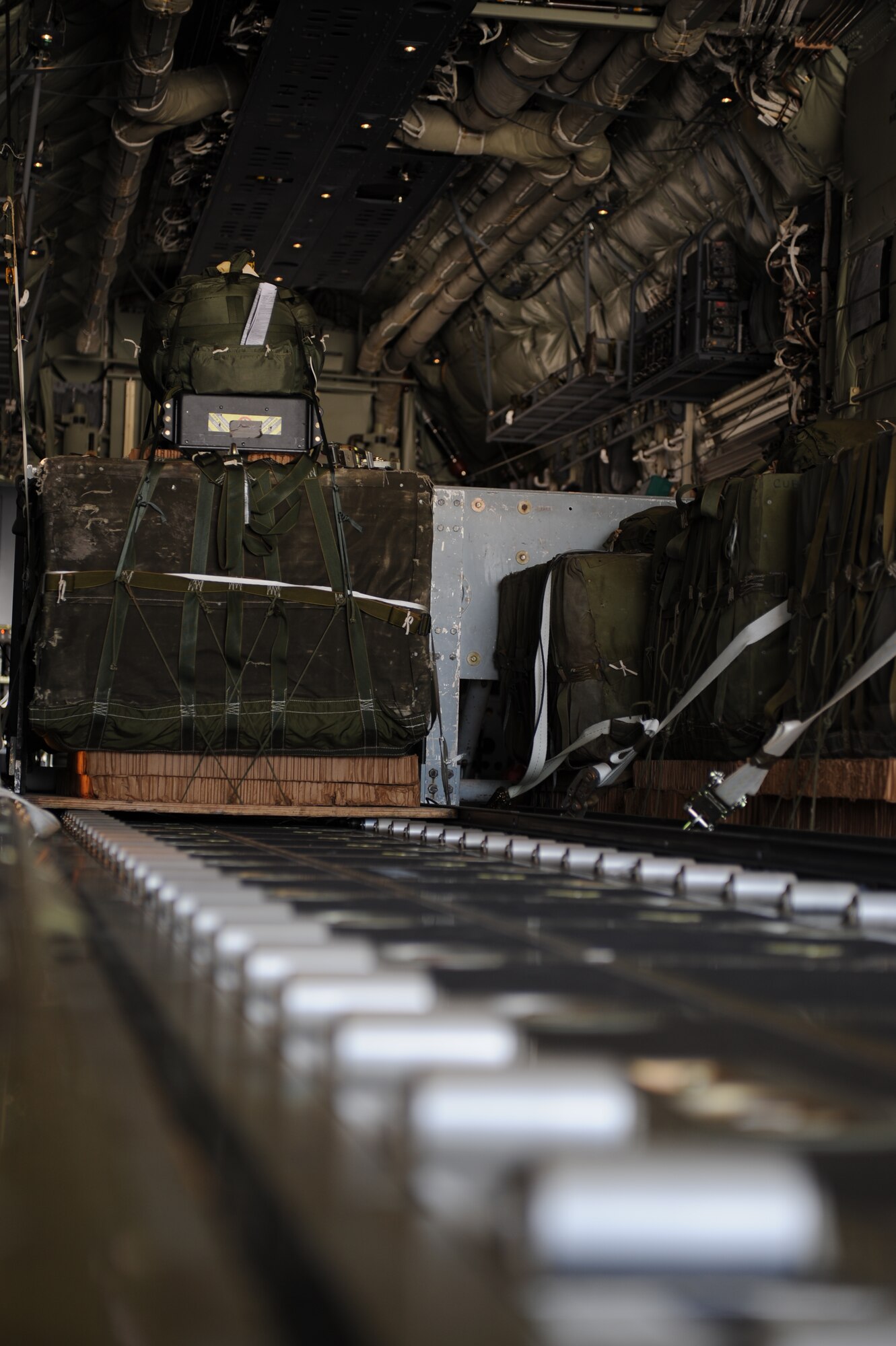A cargo bundle rigged with a Joint Precision Airdrop System (JPADS) is positioned on a C-130J Super Hercules assigned to the 317th Airlift Group  prior to an airdrop training mission Aug. 14, 2012, at Dyess Air Force Base, Texas.  JPADS is a cargo parachute system that incorporates an onboard global positioning system able to guide the cargo with pinpoint accuracy to a designated drop zone. JPADS also allows cargo to be dropped from higher attitudes, allowing aircraft to safely avoid enemy ground fire. (U.S. Air Force photo by Staff Sgt. Richard P. Ebensberger/ Released)