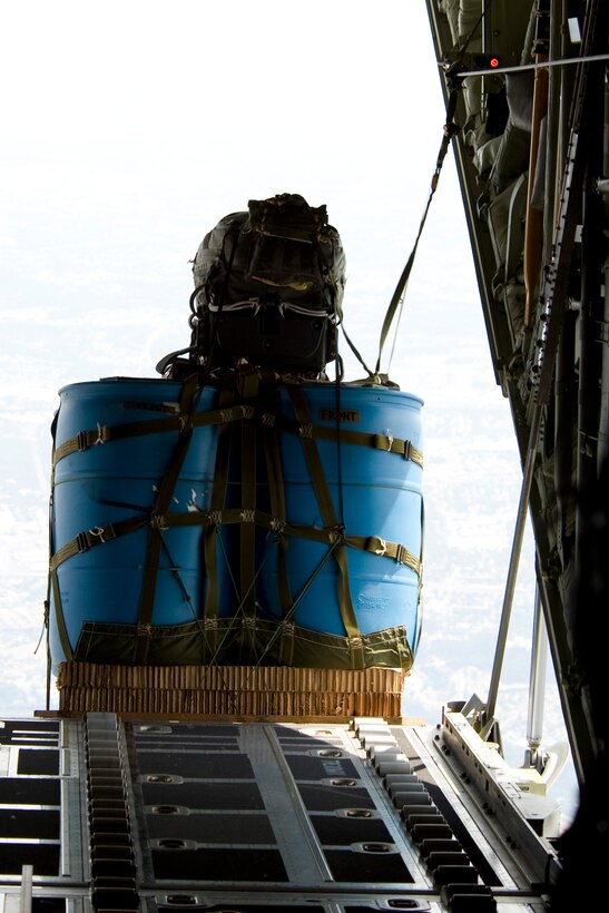 A cargo bundle rigged with a Joint Precision Airdrop System (JPADS) is dropped from a C-130J Super Hercules assigned to the 317th Airlift Group during an airdrop training mission Aug.  14, 2012, at Fort Hood, Texas.  JPADS is a cargo parachute system that incorporates an onboard global positioning system able to guide the cargo with pinpoint accuracy to a designated drop zone. JPADS also allows cargo to be dropped from higher attitudes, allowing aircraft to safely avoid enemy ground fire. (U.S. Air Force photo by Staff Sgt. Richard P. Ebensberger/ Released)