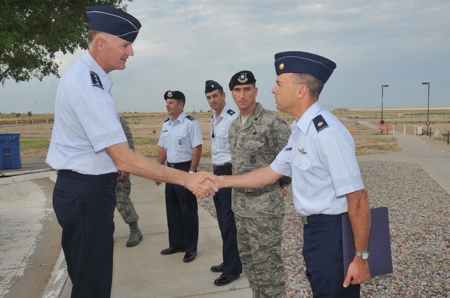 KIRTLAND AFB, N.M. -- Lt. Gen. Andrew E. Busch, Air Force Materiel Command vice commander, visited Kirtland AFB from Aug. 12 to 13. During a tour here, he had the opportunity to meet Maj. John Ladino, Air Force Nuclear Weapons Center, and, from left, Col. Paul Barney, 377th Security Forces Group commander, Lt. Col. Christopher Iriarte, 377th Maintenance Group deputy commander, and Lt. Col. Bryan Eckart, 377th Weapons System Security Squadron commander. (Photo by Todd Berenger)