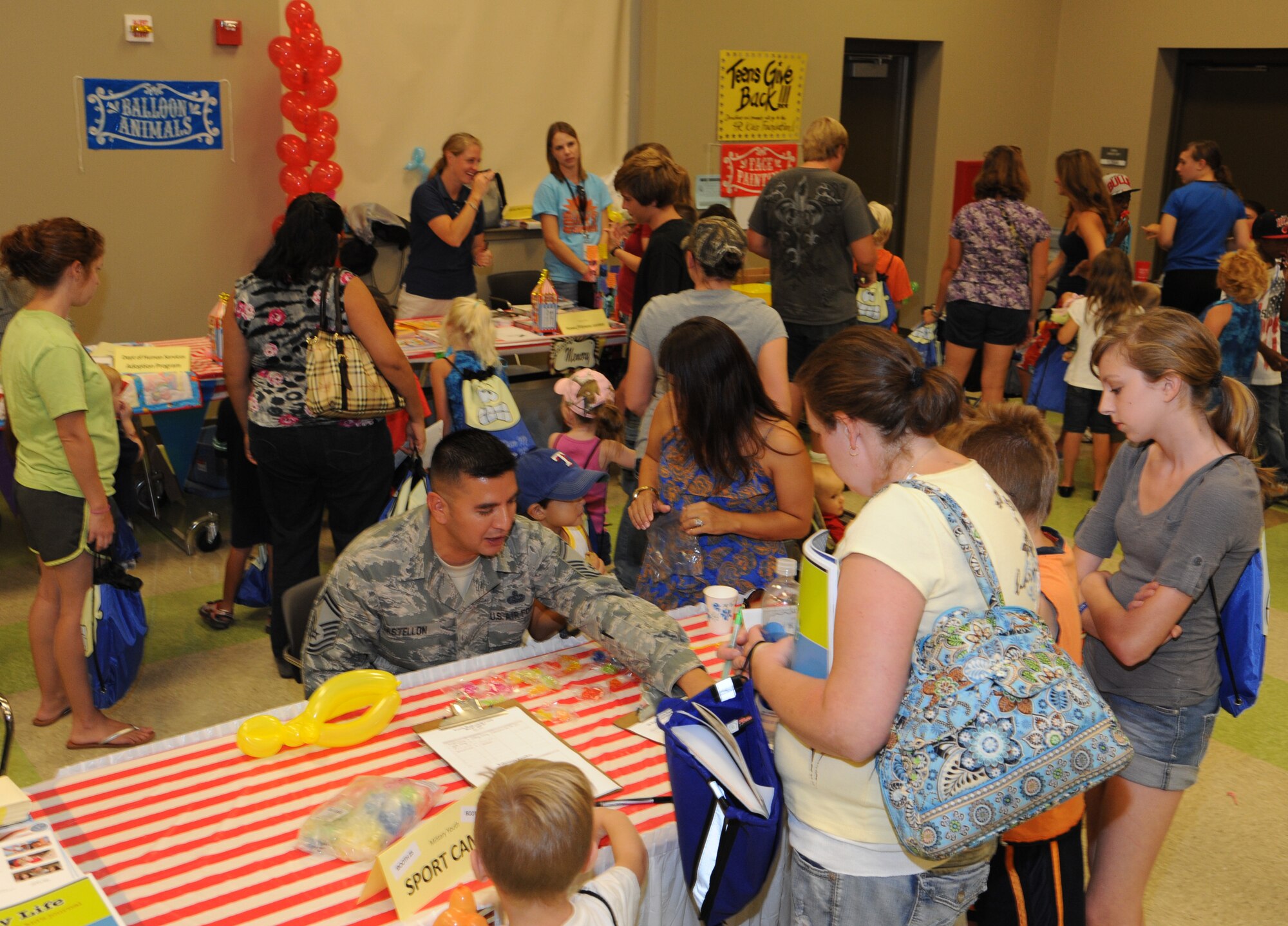 Families check out the different vendor booths at the Back to School Bash in the Armed Forces Reserve Center at Vance Air Force Base, Okla., Aug. 10. (U.S. Air Force photo/ Airman 1st Class Frank Casciotta)