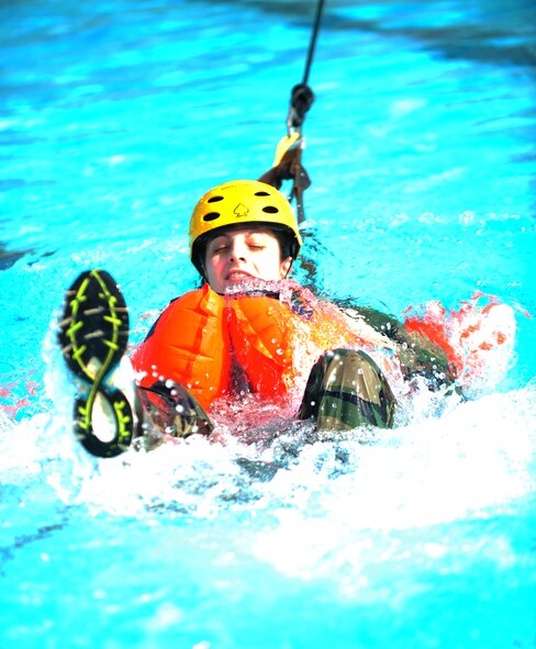 U.S. Air Force Capt.  Susan Marchiano, 347th Operations Support Squadron flight surgeon, is dragged during refresher water survival training course at Moody Air Force Base, Ga., Aug. 9, 2012. During the front and back drag Airmen were tested on the ability to release from their parachute while being in water. (U.S. Air Force photo by Staff Sgt. Stephanie Mancha/Released)
