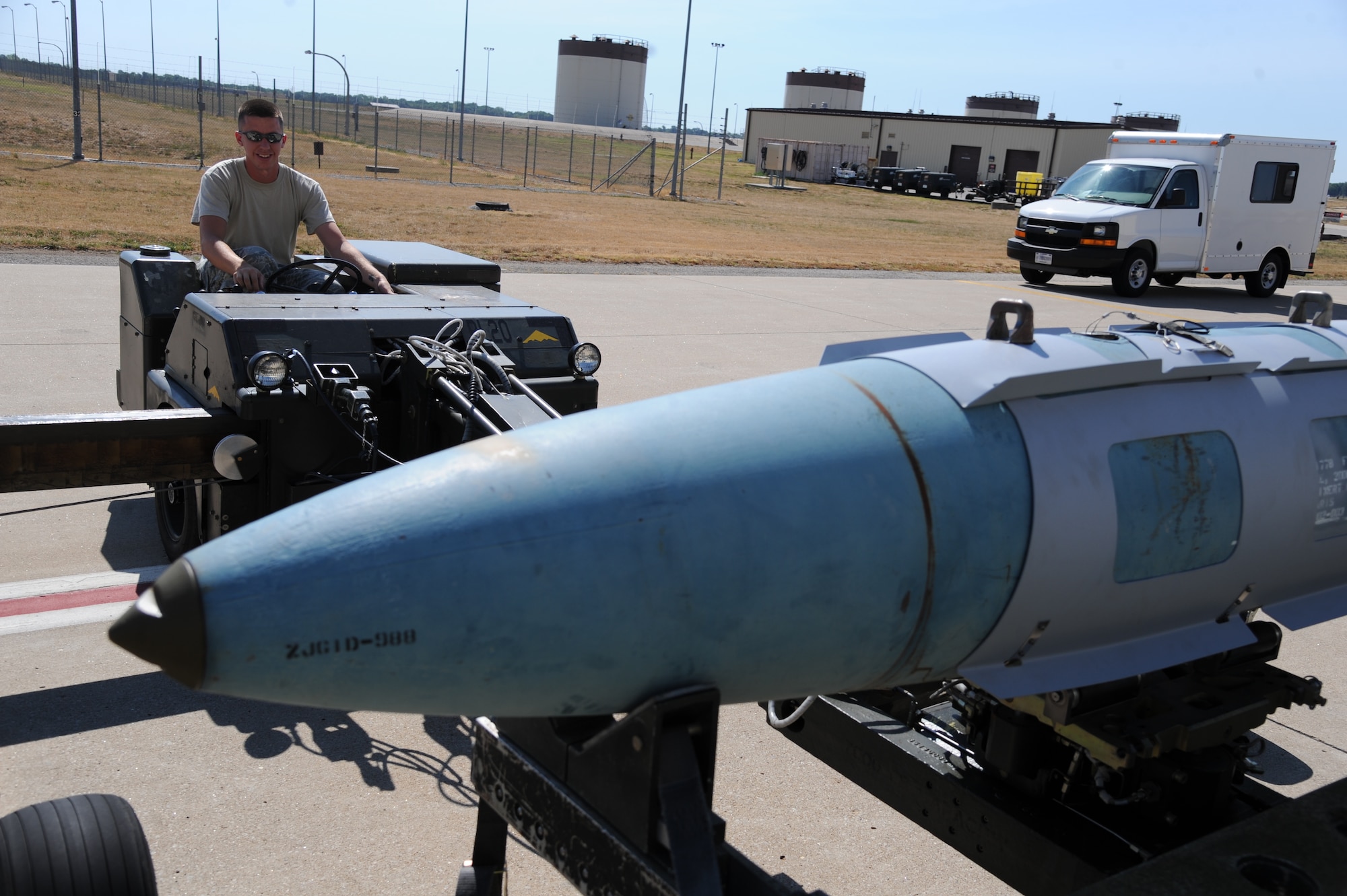 WHITEMAN AIR FORCE BASE, Mo.—Senior Airman Jordan Bland, 13th Bomb Squadron weapon load crew member, drives a MHU-83 to transport a GBU-31v1, Aug. 7, for the Air Force Global Strike Command challenge. (U.S. Air Force photo/ Senior Airman Montse Belleau)