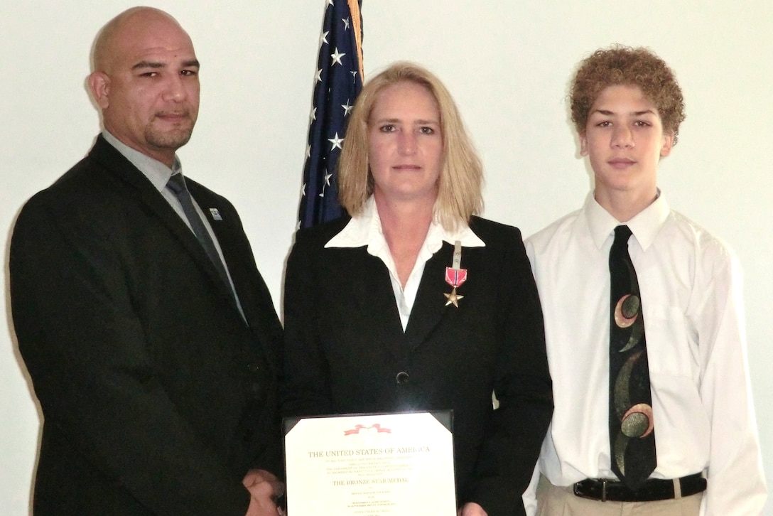 For her support and defense of operations at Bagram Airfield, Afghanistan from September 2009 through March 2010, Air Force Office of Special Investigations Special Agent Dusty Lee was awarded the Bronze Star Medal August 6. She is pictued here with her husband Eric and son Zachery. (U.S. Air Force photo provided by Special Agent Dusty Lee.)

