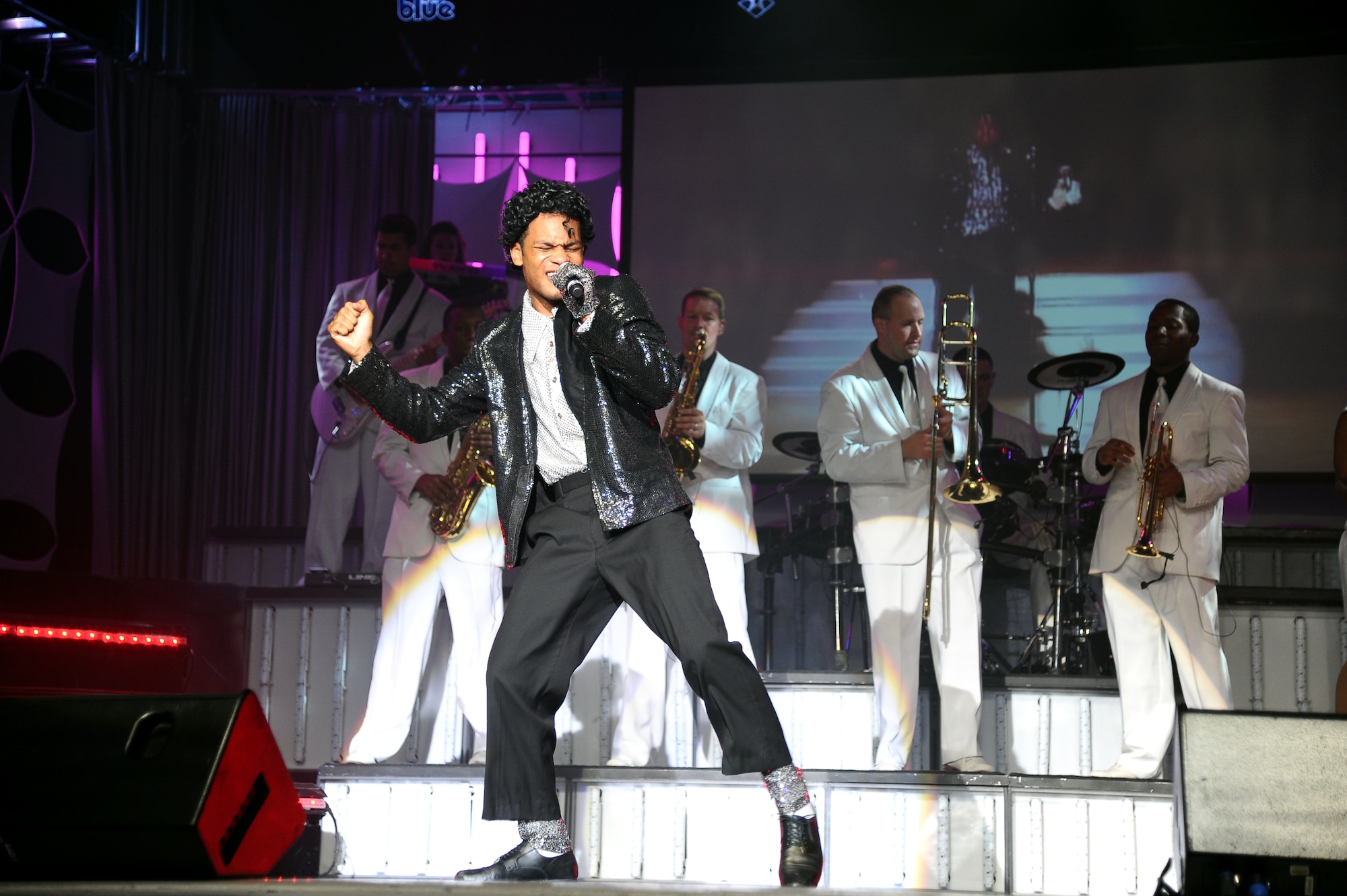 Staff Sgt. Tyron Jones, Tops in Blue 2012 vocalist, sings and dances to Michael Jackson’s “Bad” during the Tops in Blue “Listen!” 2012 World Tour Aug. 11 in Columbus, Miss.  After the competitive selection process those chosen for the Tops in Blue team must attend 60 days of training to hone their skills and prepare them for the tour ahead. (U.S. Air Force Photo/Airman 1st Class Charles Dickens)