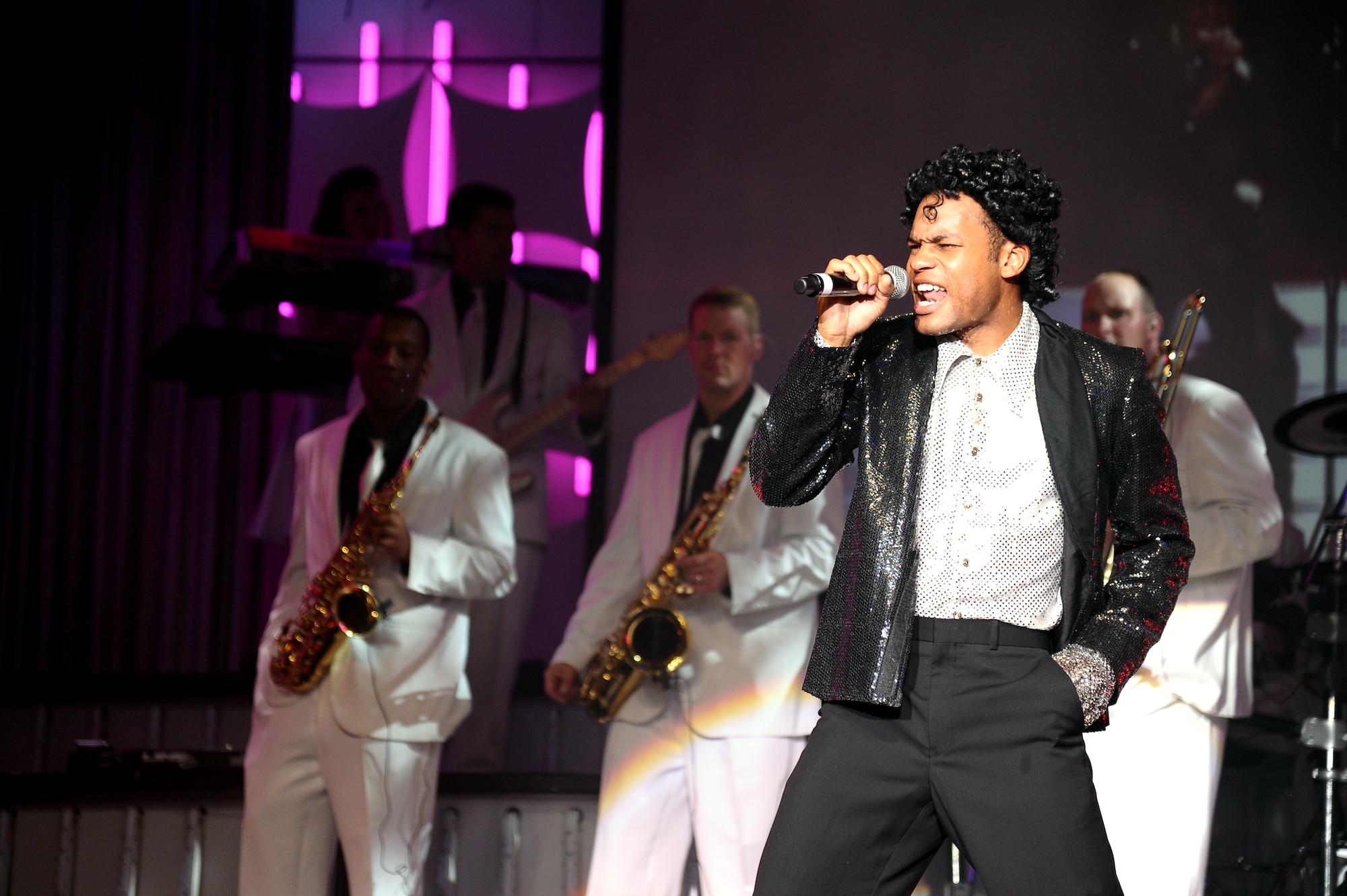 Staff Sgt. Tyron Jones, Tops in Blue 2012 vocalist, dresses as Michael Jackson to give a performance of his song “Bad” during the Tops in Blue “Listen!” 2012 World Tour Aug. 11 in Columbus, Miss.  During the 59 years that Tops in Blue has been performing they have made appearances on national television, produced albums and made performances on film in addition to their world tours. (U.S. Air Force Photo/Airman 1st Class Charles Dickens)