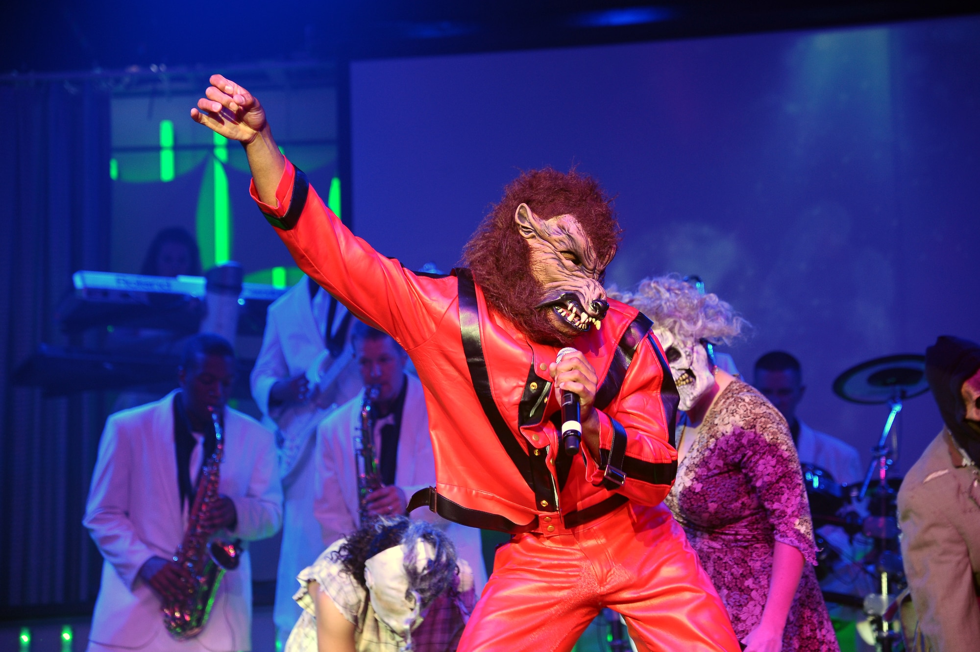 A member of the 2012 Tops in Blue team dresses as a werewolf during a tribute to Michael Jackson performing his popular song “Thriller” amid the Tops in Blue “Listen!” 2012 World Tour Aug. 11 in Columbus, Miss.   The 35 members of the 2012 Tops in Blue team won multiple skill-oriented competitions to earn a position as a member of the group.  (U.S. Air Force Photo/Airman 1st Class Charles Dickens)