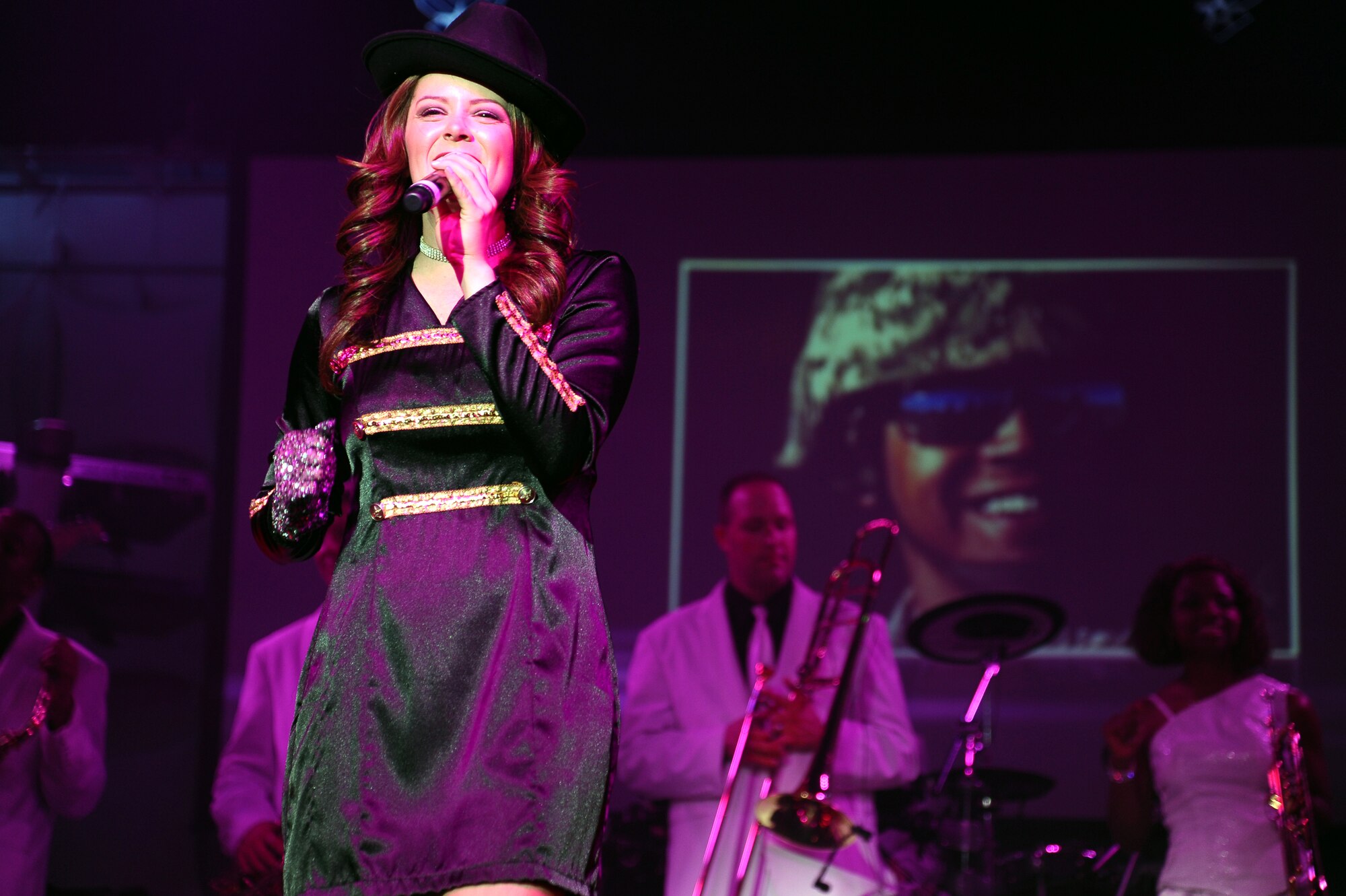 Capt. Ashley Elmore, Tops in Blue 2012 vocalist and officer-in-charge, sings during a tribute to Michael Jackson and fellow service members during the Tops in Blue “Listen!” 2012 World Tour Aug. 11 in Columbus, Miss.  Tops in Blue is an organization that has been delivering entertainment to service and community members since 1953.  (U.S. Air Force Photo/Airman 1st Class Charles Dickens)