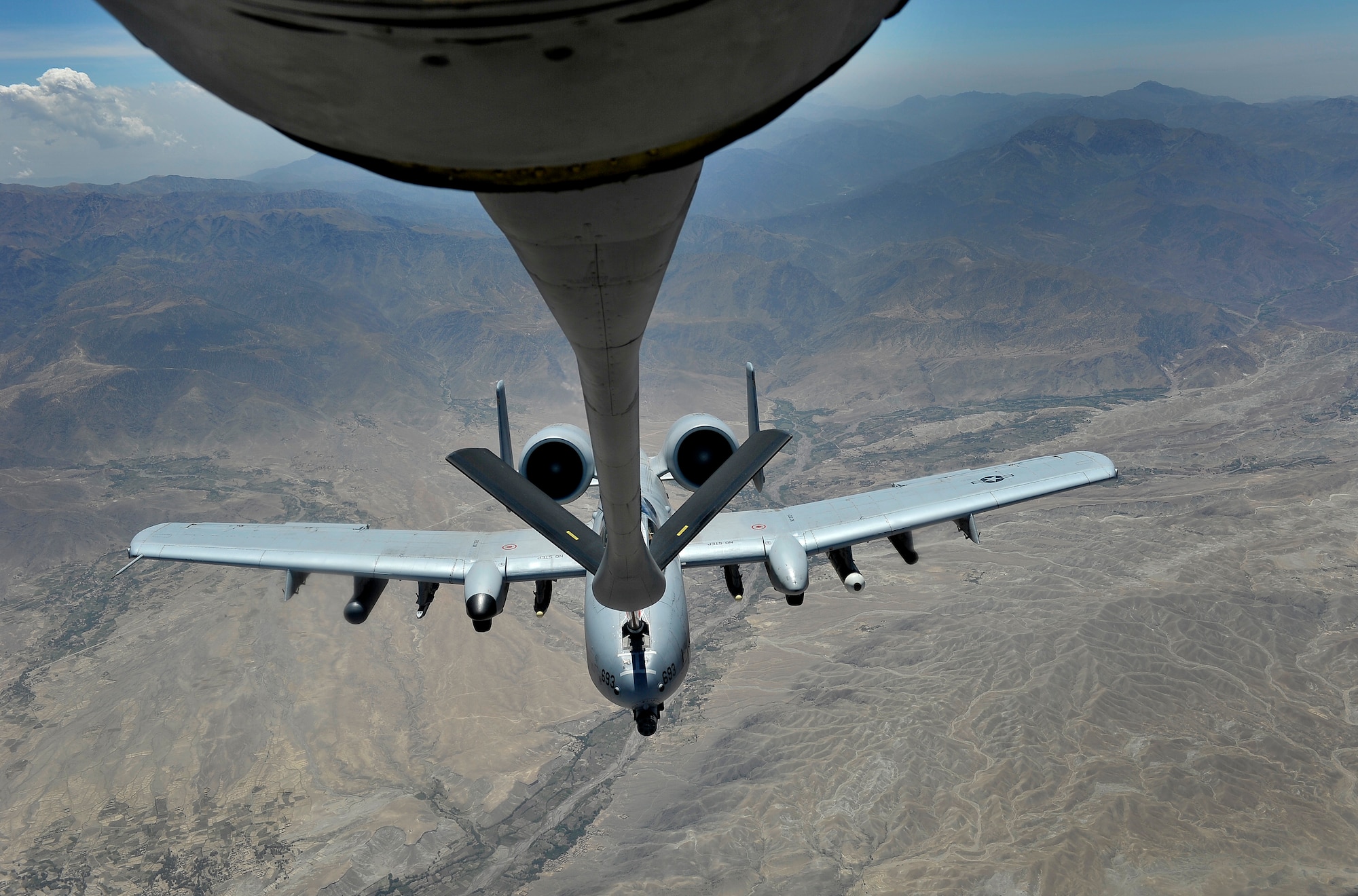 A U.S. A-10 Thunderbolt is refueled over Afghanistan during overseas contingency operations, August 2, 2012. The 22d Expeditionary Air Refueling Sq. (EARS) conducts missions out of Transit Center at Manas, Kyrgyzstan, and plays an integral role in keeping air assets refueled in support of U.S. and coalition ground forces. (U.S. Air Force photo/Staff Sgt. Clay Lancaster/ Released)