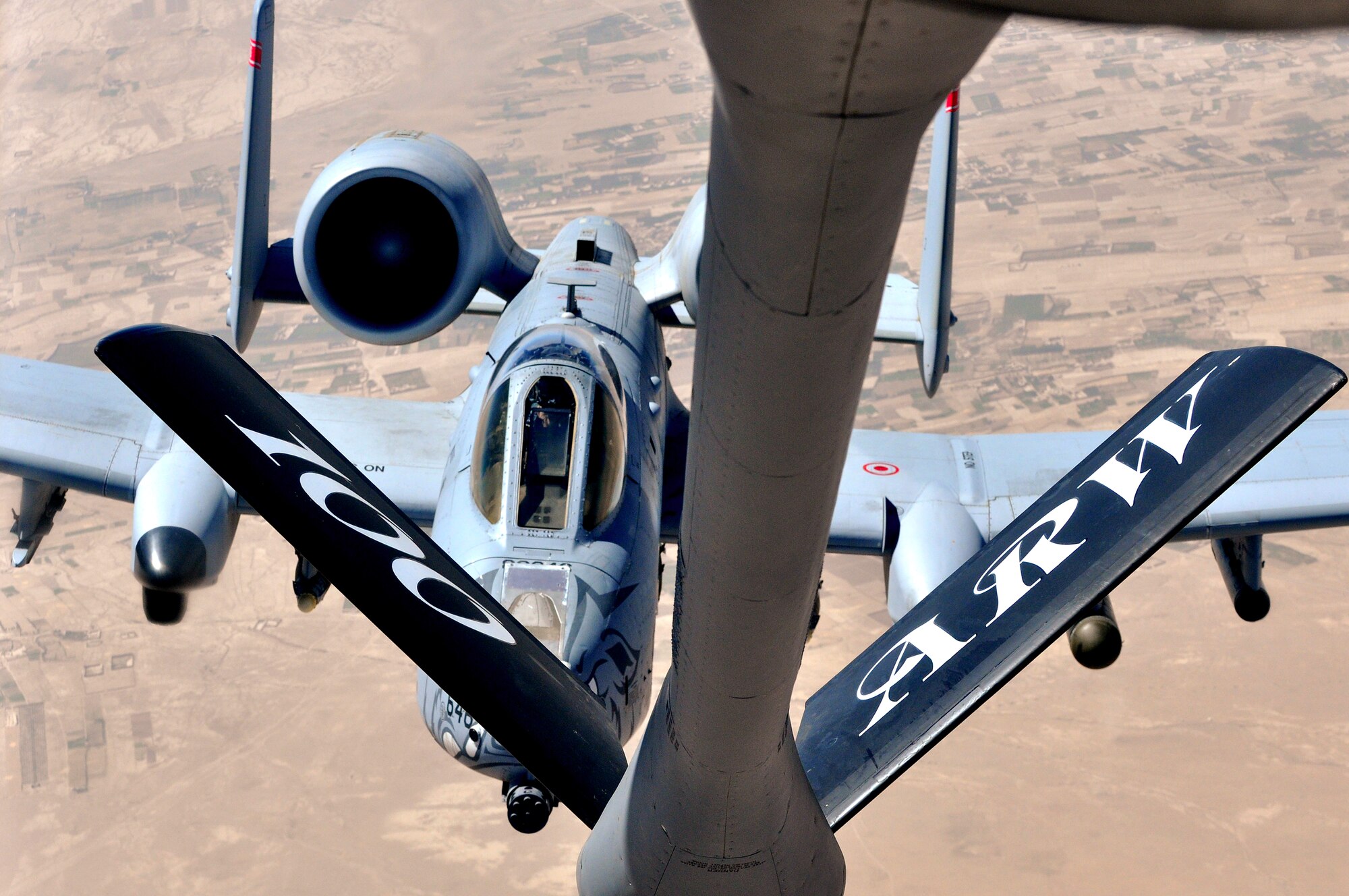 A U.S. Air Force 22nd Expeditionary Air Refueling Squadron KC-135 Stratotanker refuels a U.S. Air Force A-10 Thunderbolt over Afghanistan, Aug. 2, 2012. The 22nd EARS provides aerial refueling support to Air Force, Navy, Marine Corps and allied nation aircraft in support of Operation Enduring Freedom. (U.S. Air Force photo/ Staff Sgt. Alexandria Mosness)(Released)