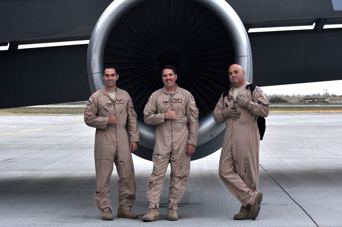 U.S. Air Force 22nd Expeditionary Air Refueling Squadron members 1st Lt. Josh Ishiki, copilot, Capt. Michael Curtis, aircraft commander and Master Sgt. Eric Faurott, boom operator, give the shaka or hang loose sign after a mission on the flightline, Transit Center at Manas, Kyrgyzstan, Aug. 2, 2012. The shaka sign is native to Hawaii and is a sign of salutation that means friendship. The three team members are all members of the Hawaiian Air National Guard who work together to fuel the fight for Operation Enduring Freedom.  The group is one of the many 22nd EARS crew who flies the KC-135 Stratotanker over Afghanistan to provide aerial refueling support to Air Force, Navy, Marine Corps and allied nation aircraft. (U.S. Air Force photo/ Staff Sgt. Michelle Revoir)(Released)
