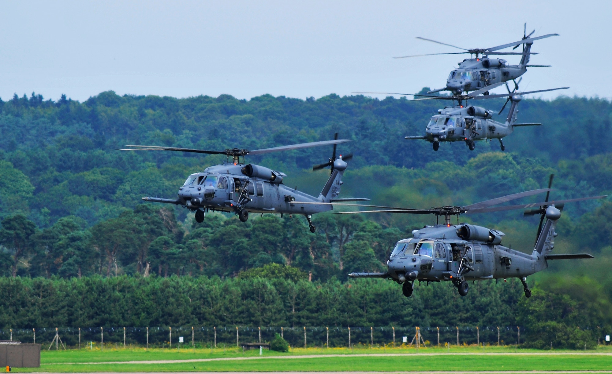 ROYAL AIR FORCE LAKENHEATH, England - A four-ship fleet of 56th Rescue Squadron HH-60G Pave Hawks fly past the air traffic control tower Aug. 13, 2012. This is the first time the 56th RQS has flown more than three helicopters at once since arriving at RAF Lakenheath in 2006. (U.S. Air Force photo by Senior Airman Tiffany M. Grigg)