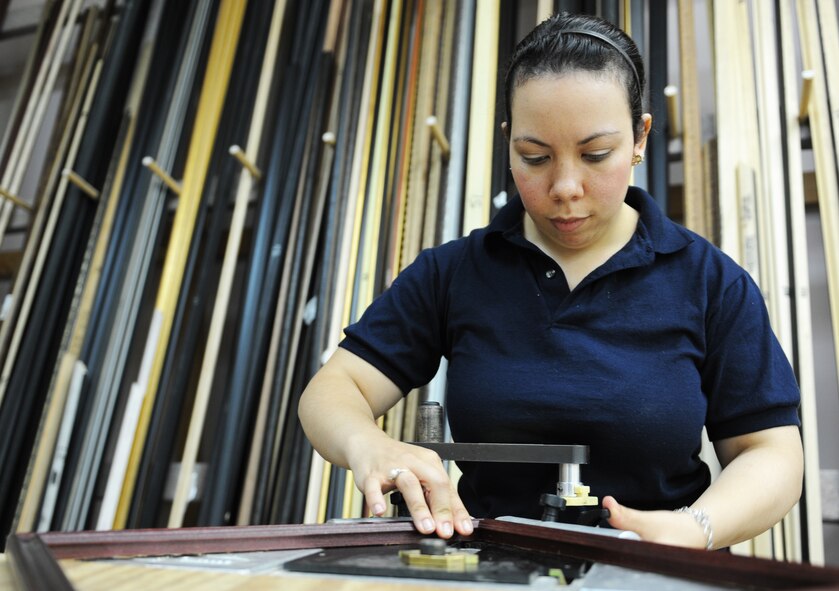 Adine Close, 35th Force Support Squadron recreation aide, staples a frame together in The Frame Shop at Misawa Air Base, Japan, Aug. 15, 2012. The shop is open Monday through Friday from 10 a.m. until 6 p.m., but is closed the last day of every month for inventory. (U.S. Air Force photo by Airman 1st Class Kia Atkins/Released)