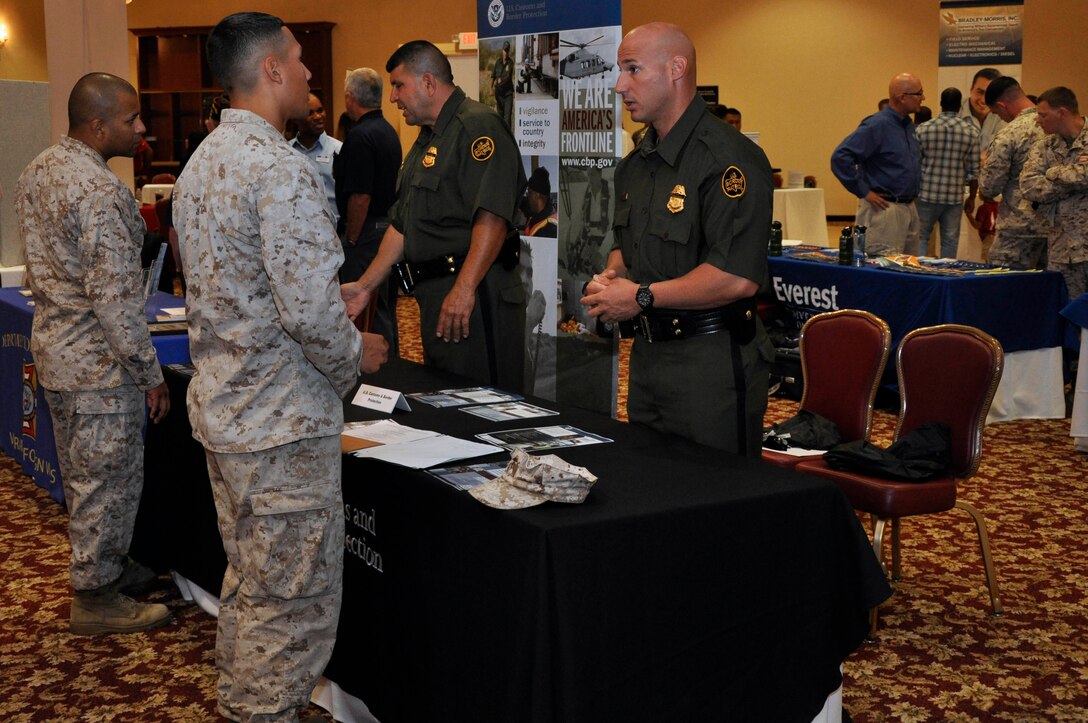 Members of the United States Department of Homeland Security's US Customs and Border Protection, Inform Marines of job opportunities during the CivilanJobs.com career expo at Camp Pendleton's Pacific Views Event Center Aug. 15.
