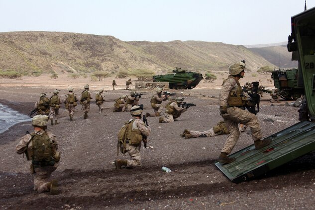 Marines with Alpha Company, Battalion Landing Team, 1st Battalion, 2nd Marine Regiment, 24th Marine Expeditionary Unit, assault a beachhead during an amphibious training raid in Djibouti, Aug. 15, 2012. Elements of the 24th MEU are operating in and around Djibouti, taking part in and coordinating various unilateral exercises and bilateral events with foreign militaries. The 24th MEU is deployed with the Iwo Jima Amphibious Ready Group as a theater reserve and crisis response force in support of U.S. Central Command and the U.S. Navy's 5th Fleet area of responsibility.