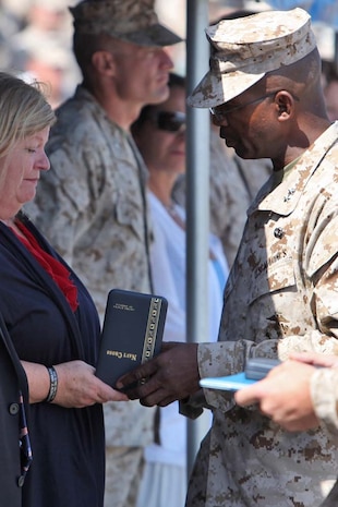 Major Gen. Ronald L. Bailey, commanding general, 1st Marine Division, presents the Navy Cross to Sgt. Matthew T. Abbateâ€™s mother during a Navy Cross award ceremony aboard Camp Pendleton, Calif., Aug. 10. Abbate was posthumously awarded the medal for the actions he took on Oct. 14, 2010 in Sangin, Afghanistan during his deployment as a scout sniper with Company K, 3rd Battalion, 5th Marines, 1st Marine Division. Abbate was killed in action in Helmand Province later that year.