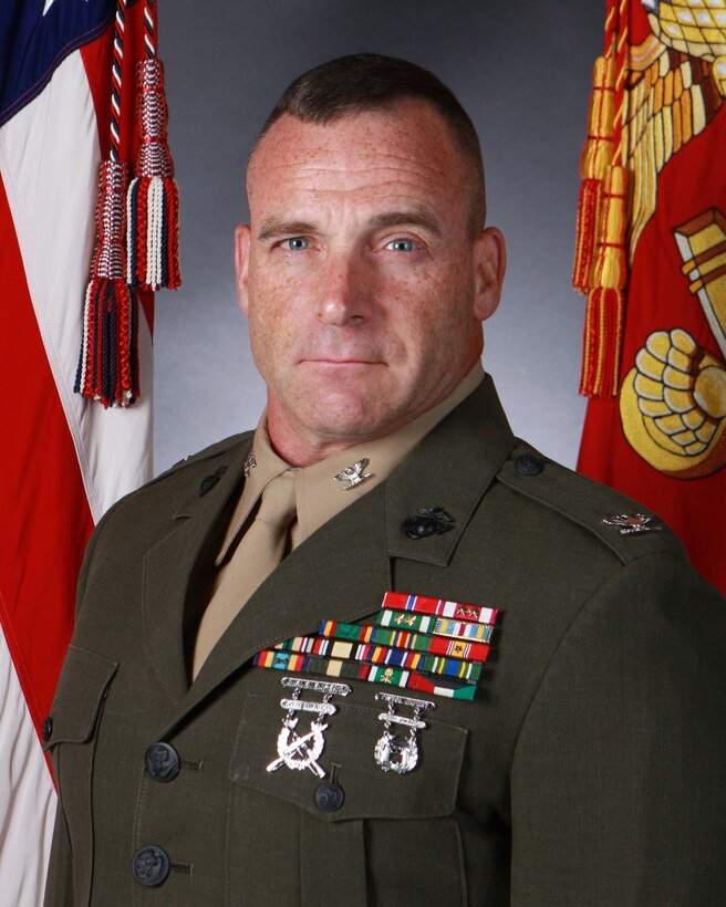 Born and raised in Niagara Falls, New York.  Following his senior year of football at the State University of New York at Buffalo (UB) he took a semester off to attend Recruit Training at Parris Island in January of 1986.  Upon the completion of Entry Level Training and Communications School he was assigned as a 2512 (Field Wireman) to H&S Co, 8th Tank Battalion, Rochester, New York in June of 1986.  In the spring of 1988, he graduated with a Bachelor of Science in Social Science Interdisciplinary Studies from the University of Buffalo.  Following graduation, he was selected for Officer Candidate School and subsequently commissioned as a Second Lieutenant in April of 1989