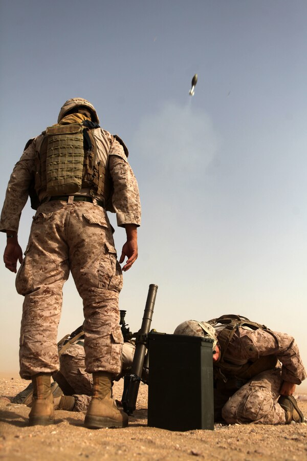 UDAIRI RANGE, Kuwait (Aug. 5, 2012) U.S. Marine Corps mortarmen, assigned to Charlie Company, Battalion Landing Team 1st Battalion, 2nd Marine Regiment, 24th Marine Expeditionary Unit, fire mortars during a live-fire shoot at Udairi Range in Kuwait, Aug. 5, 2012. The 24th MEU is deployed with the Iwo Jima Amphibious Ready Group as a U.S. Central Command theater reserve force providing support for maritime security operations and theater security cooperation efforts in the U.S. 5th Fleet area of responsibility. (U.S. Marine Corps photo by Sgt. Richard Blumenstein/Released)