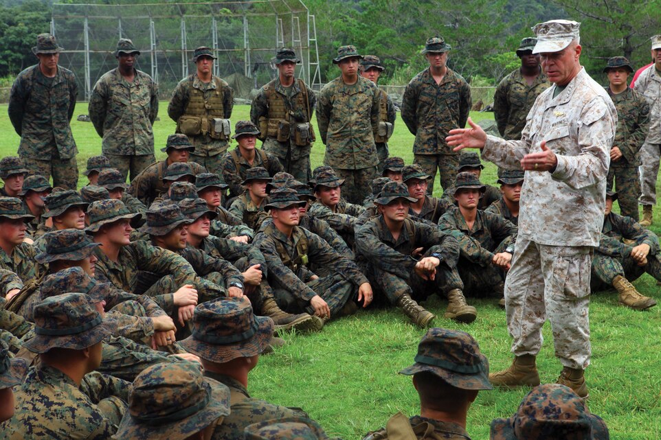 Gen. James F. Amos, the commandant of the Marine Corps, speaks to Marines about the importance of their training at the Jungle Warfare Training Center Aug. 12. The Marines are with Company E, 2nd Battalion, 3rd Marine Regiment, 3rd Marine Division, III Marine Expeditionary Force, based out of Hawaii and in Okinawa under the unit deployment program. 