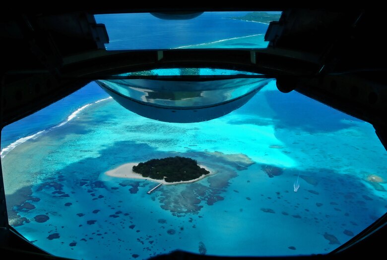 ANDERSEN AIR FORCE BASE, Guam – The KC-135 Stratotanker flew over various islands around Guam during the flight here, Aug. 11. The incentive flight took Team Andersen Airmen up to observe an air refueling with a B-52 Stratofortress. (U.S. Air Force photo by Airman 1st Class Marianique Santos/Released)