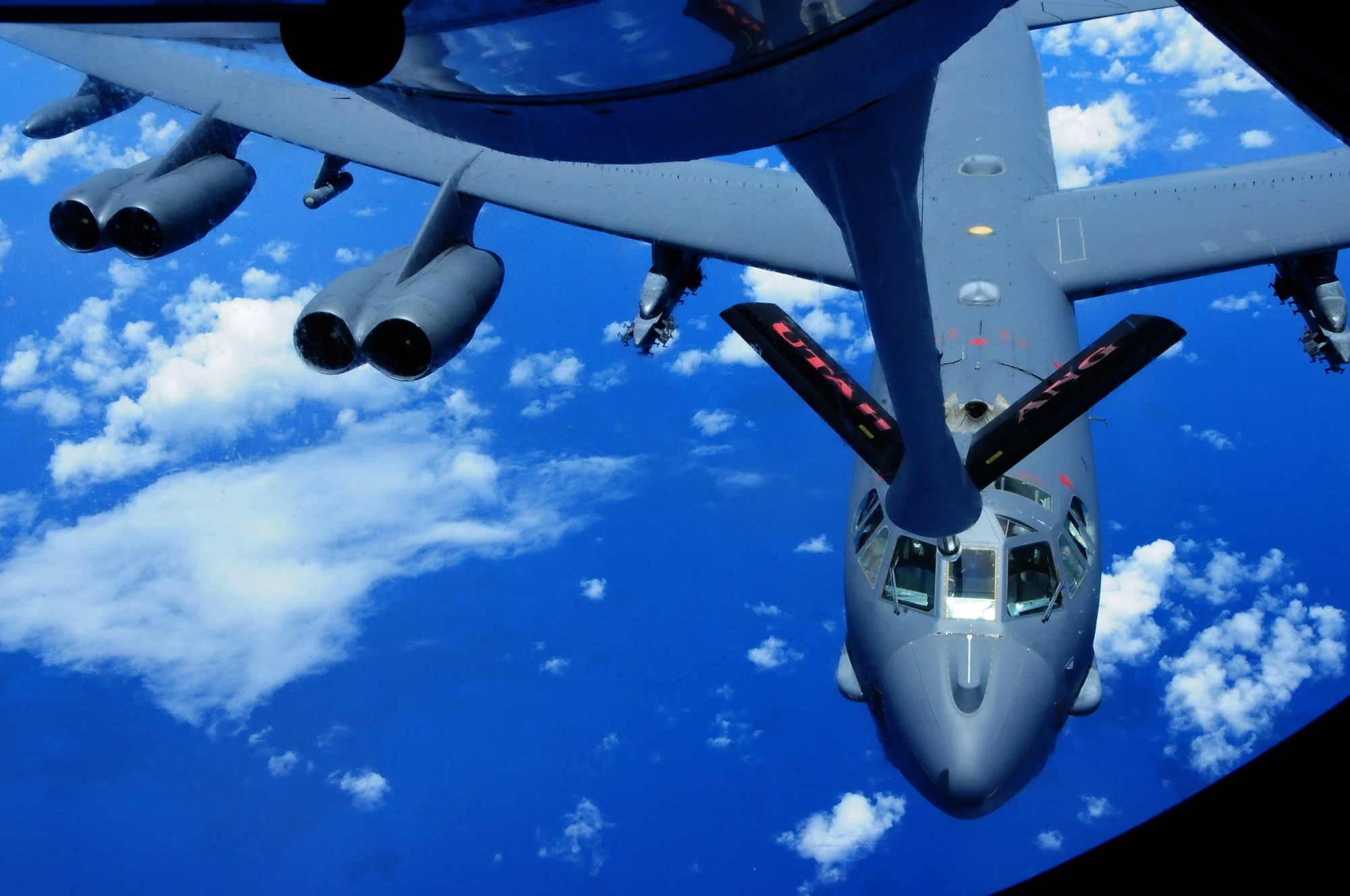 ANDERSEN AIR FORCE BASE, Guam – A B-52 Stratofortress tries to connect to a KC-135 Stratotanker in order to execute aerial refueling here, Aug. 10. The incentive flight took Team Andersen Airmen up to observe an air refueling with a B-52 Stratofortress. (U.S. Air Force photo by Airman 1st Class Marianique Santos/Released)