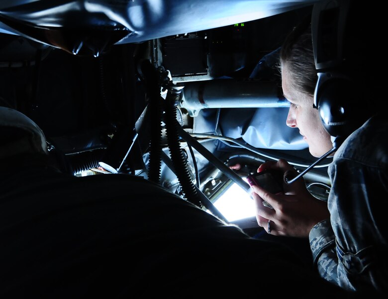 ANDERSEN AIR FORCE BASE, Guam – Airman 1st Class Melinda Arquette, 36th Medical Operations Squadron medical technician, takes photographs of the aerial refueling of a B-52 Stratofortress during an incentive flight, Aug. 10. The aerial refueling is one of the highlights of a KC-135 incentive flight. (U.S. Air Force photo by Airman 1st Class Marianique Santos/Released)