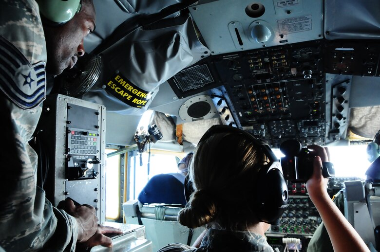 ANDERSEN AIR FORCE BASE, Guam – Tech. Sgt. Jermaine Smith, 36th Comptroller Squadron budget analyst, and Airman 1st Class Erika Stecker, 36th Wing public affairs broadcaster, sat in the cockpit with the 506th Expeditionary Air Refueling Squadron pilots during an incentive flight on a KC-135 Stratotanker here, Aug. 10. The Airmen got to take turns sitting in the cockpit and watching the refueling beside the boom operator. (U.S. Air Force photo by Airman 1st Class Marianique Santos/Released)