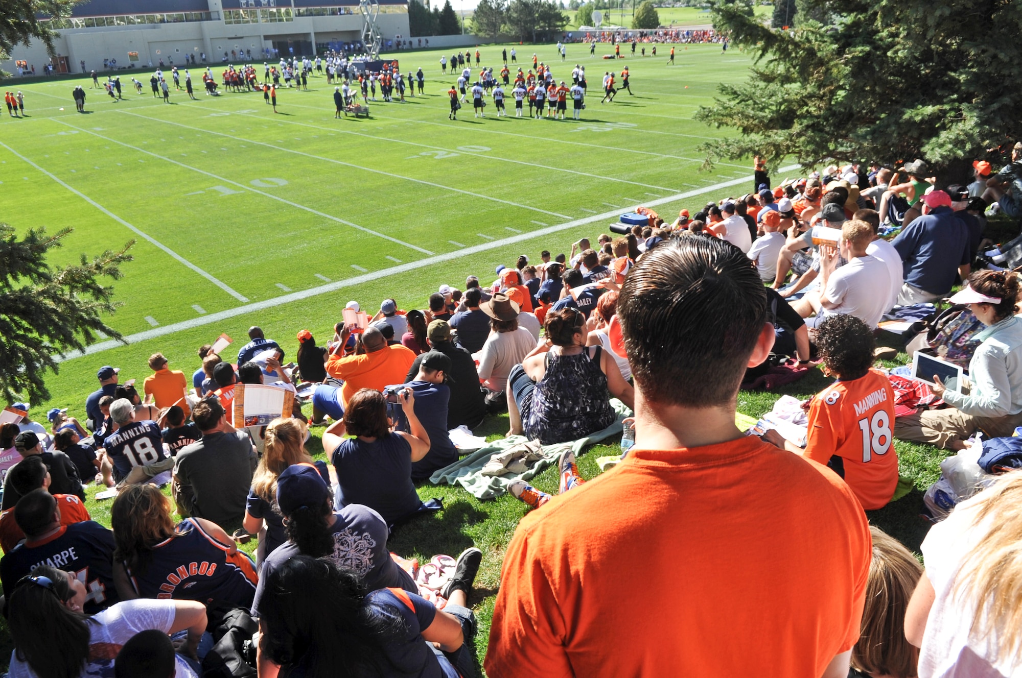 ENGLEWOOD, Colo. – More than 4,300 fans made their way to the Denver Bronco’s training camp July 26, 2012 to watch players participate in their first training camp session opened to the public. One of those players was Benjamin Garland, defensive end and a lieutenant with the 140th Wing Public Affairs, Buckley Air Force Base. (U.S. Air Force photo by Senior Airman Christopher Gross)