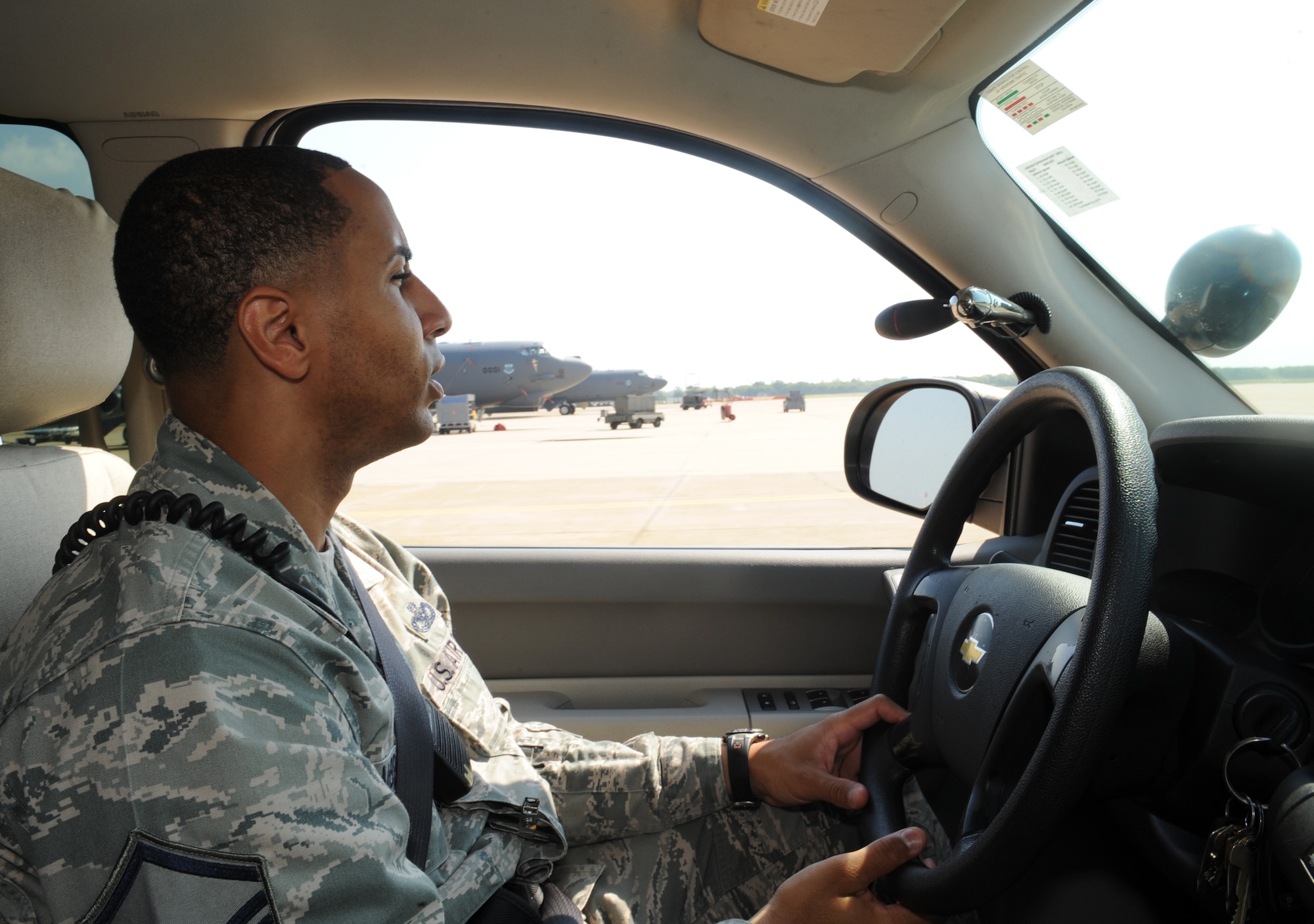 Master Sgt. Andre McBride, 2nd Security Forces Squadron flight chief, patrols the flightline on Barksdale Air Force Base, La., Aug. 10. When patrolling the flightline, 2 SFS Airmen ensure no one is tampering with the aircraft. They also ensure that personnel with restricted area access have their credentials and that visitors are being properly escorted. (U.S. Air Force photo/Airman 1st Class Benjamin Gonsier)(RELEASED)
