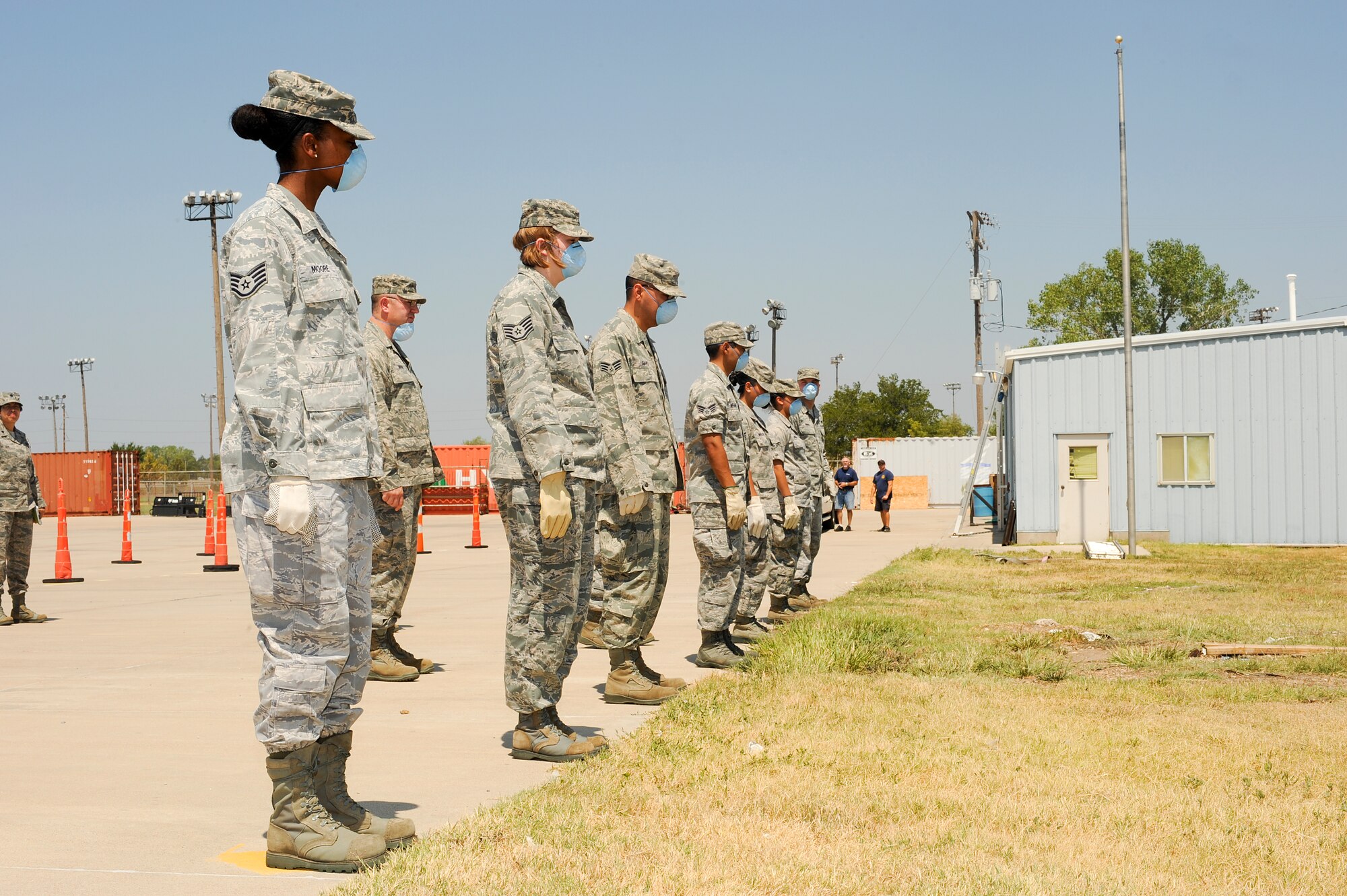 Airmen of the 22nd Force Support Squadron prepare to perform search and recovery operations during a major accident readiness exercise Aug. 15, 2012, Wichita, Kan. The MARE was held to prepare Team McConnell for an emergency during the 2012 Wings Over McConnell Open House and Air Show. (U.S. Air Force photo/Airman 1st Class Jose L. Leon)