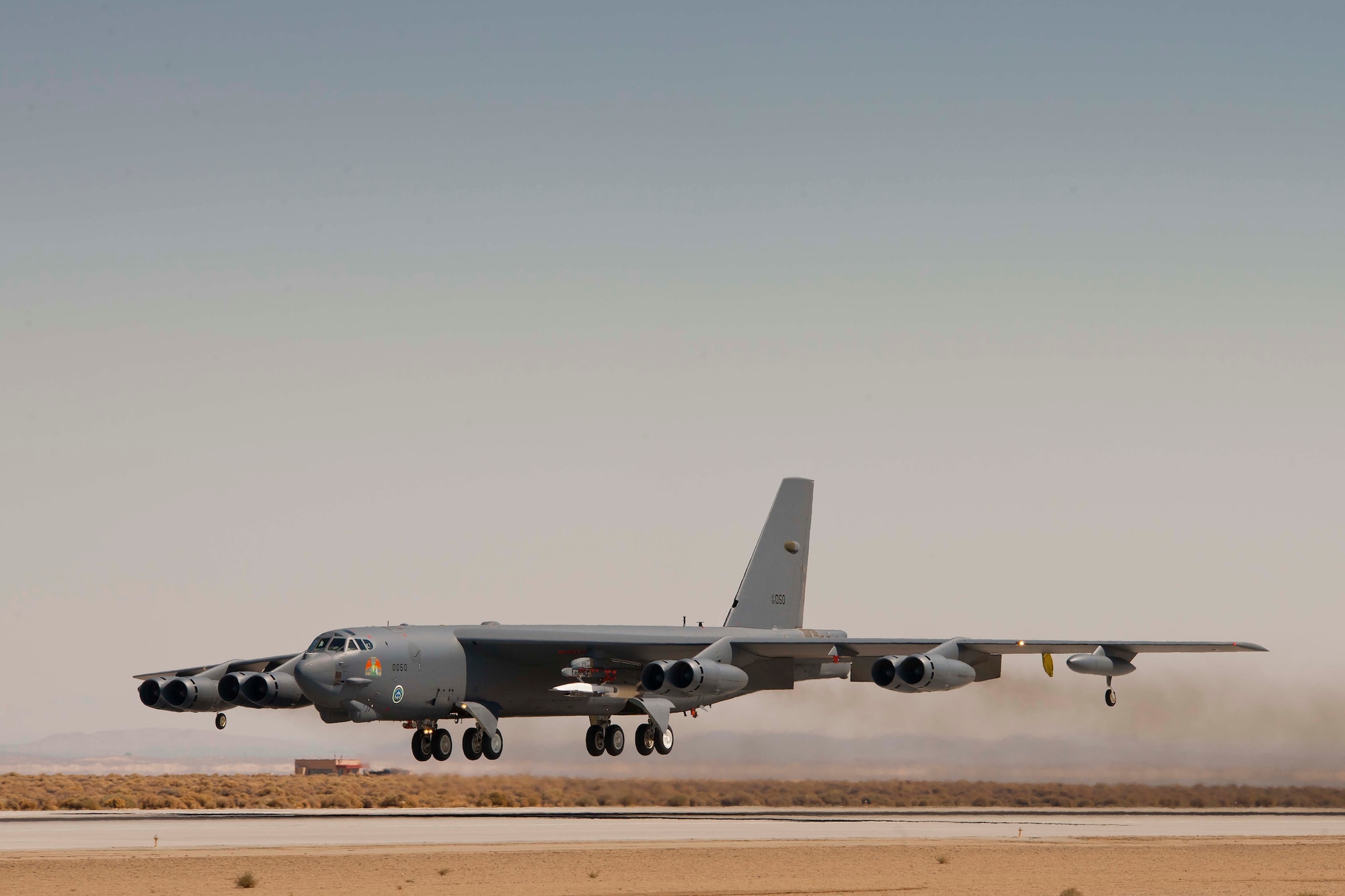 The B-52 Stratofortress carrying the X-51A Waverider takes off from Edwards Air Force Base, Calif., in preparation for the Aug. 14, 2012, test flight. The test ended prematurely when a fault with a control fin caused the vehicle to lose control. (Courtesy photo)