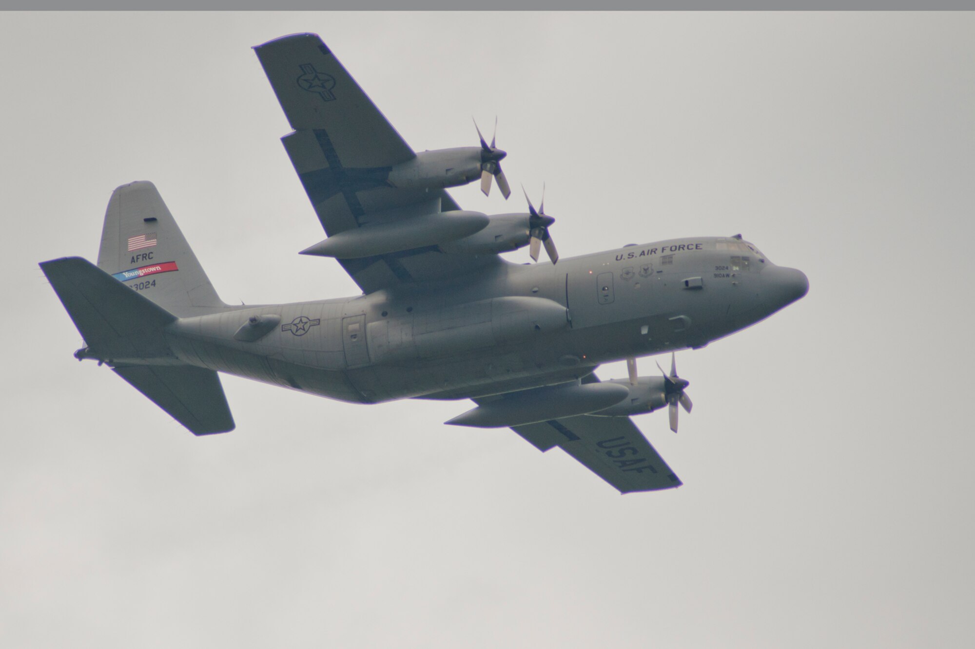 RAVENNA, Ohio -- A C-130H Hercules aircraft from Youngstown Air Reserve Station, flies over Camp Ravenna Joint Military Training Center here, Aug. 14, 2012 prior to the 2012 Media Flight cargo airdrop. Nine members of the Youngstown-area media flew aboard a C-130H Hercules aircraft and experienced the 910th Airlift Wing mission first-hand. U.S. Air Force photo by Tech. Sgt. Brenda Haines/Released