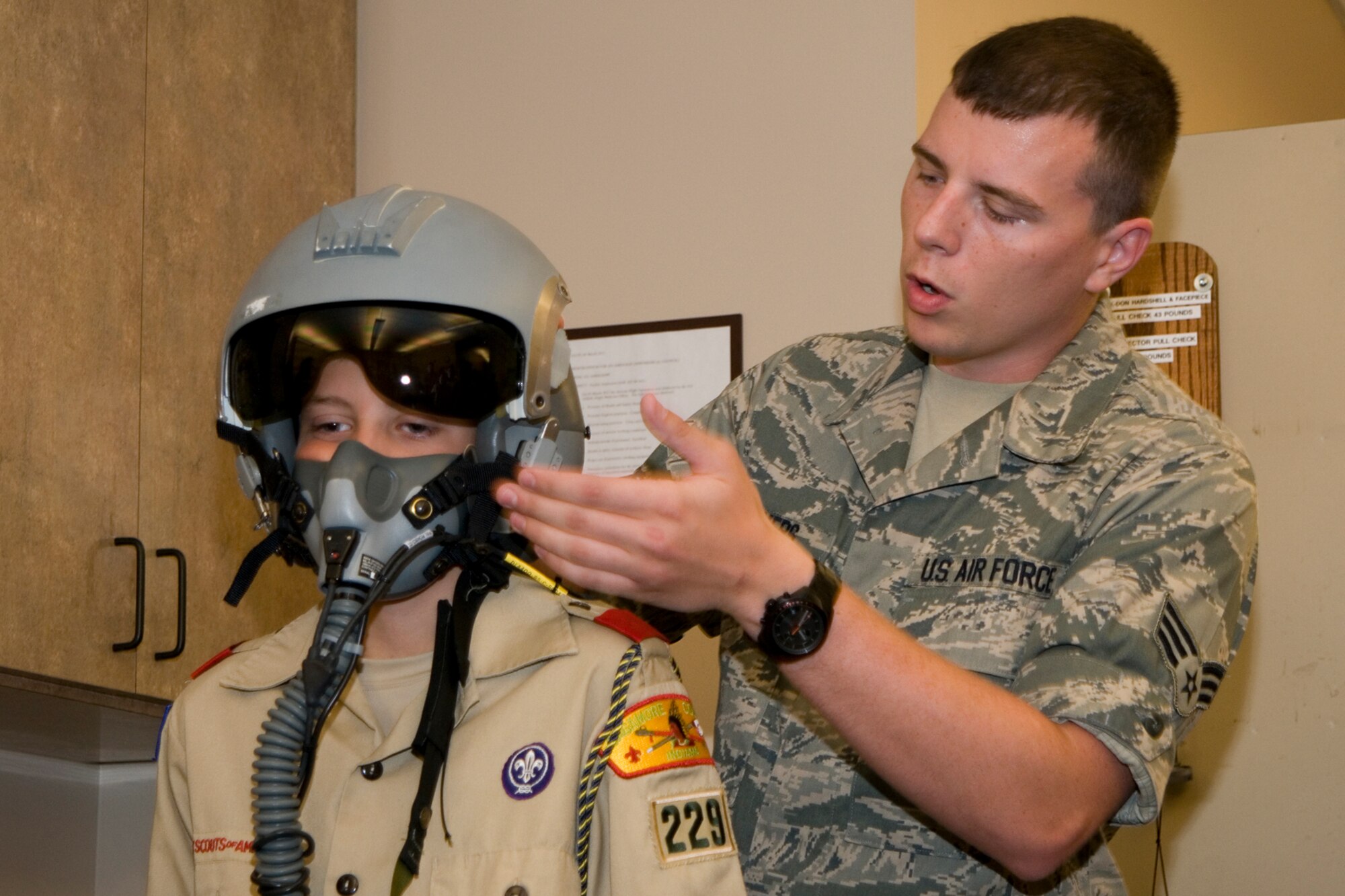 GRISSOM AIR RESERVE BASE, Ind. -- Senior Airman Matthew Devers, 434th Operations Support Squadron aircrew flight equipment apprentice, shows Boy Scouts from Troop 229 how to test an oxygen mask worn by aircrew prior to flight during a base tour July 25. The Boy Scouts visited Grissom to learn about the diverse jobs performed on base. (U.S. Air Force photo/Senior Airman Andrew McLaughlin)
