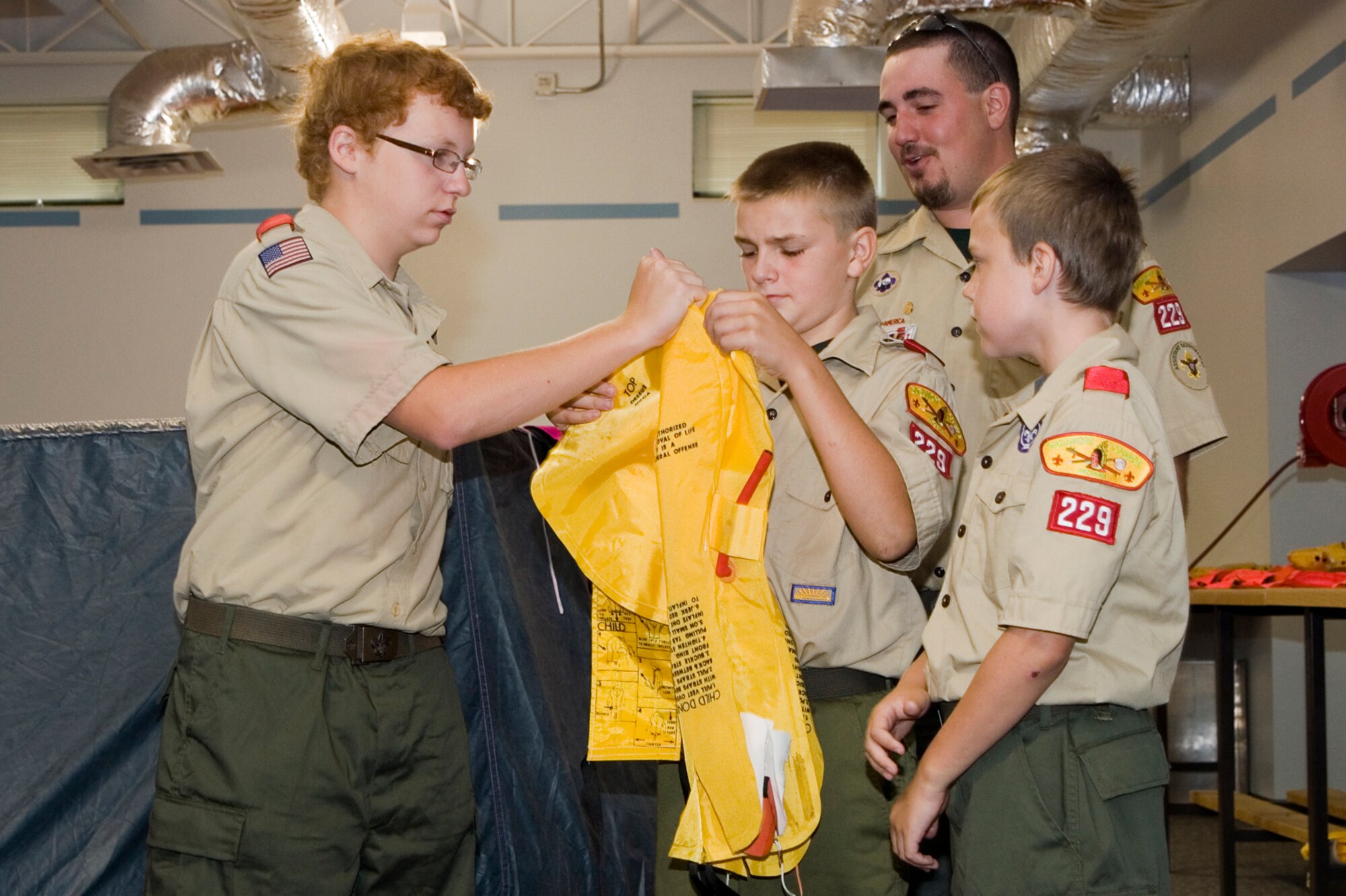 GRISSOM AIR RESERVE BASE, Ind. -- Boy Scouts from Troop 229 take a look at an emergency floatation vest at the 434th aircrew flight equipment section during a base tour July 25. The Boy Scouts also saw a KC-135R Stratotanker on display and visited the Grissom Fire Department to learn about the diverse jobs performed on base. (U.S. Air Force photo/Senior Airman Andrew McLaughlin)
