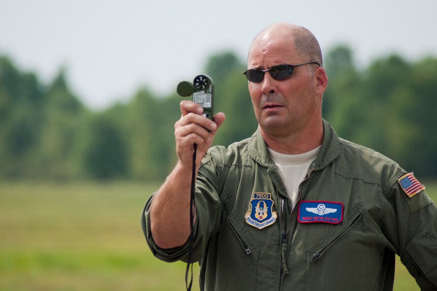 RAVENNA, Ohio -- U.S. Air Force Reserve Senior Master Sgt. Bryan Watson, a loadmaster with the 910th Operations Group based at Youngstown Air Reserve Station, checks the wind speed at the Camp Ravenna Joint Military Training Center here, Aug. 14, 2012 while performing ground checks prior to the 2012 Media Flight cargo airdrop. Nine members of the Youngstown-area media flew aboard a C-130H Hercules aircraft and experienced 910th Airlift Wing mission first-hand. U.S. Air Force photo by Tech. Sgt. Brenda Haines/Released