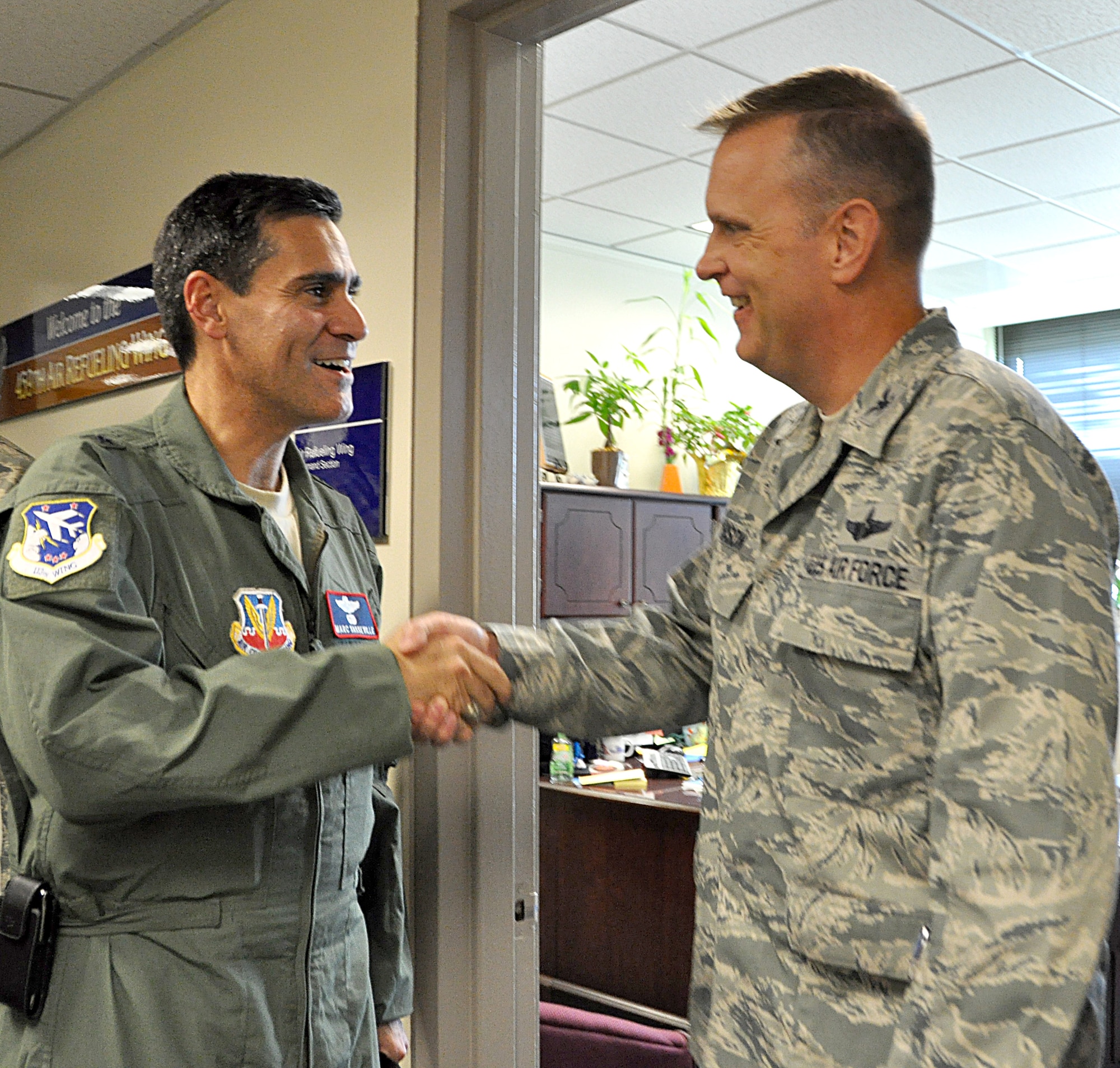 JOINT BASE ANDREWS, Md. - Col. William Mason, commander, 459th Air Refueling Wing  here, shakes the hand of Brig. Gen. Marc Sasseville, commander, 113th Wing, District of Columbia Air National Guard,  during a visit to the 459 ARW where both commanders met and discussed their unit’s mission and ways to work together,  Aug. 16, 2012.  Mason and Sasseville are both new commanders to their units. Mason previously served as the commander of the 931st Air Refueling Group, McConnell  Air Force Base, Kan., and Sasseville served as the Deputy Director of Readiness, Office of the Assistant Secretary of Defense for Reserve Affairs at the Pentagon.(U.S Air Force photo/ Senior Airman Katie Spencer) 
