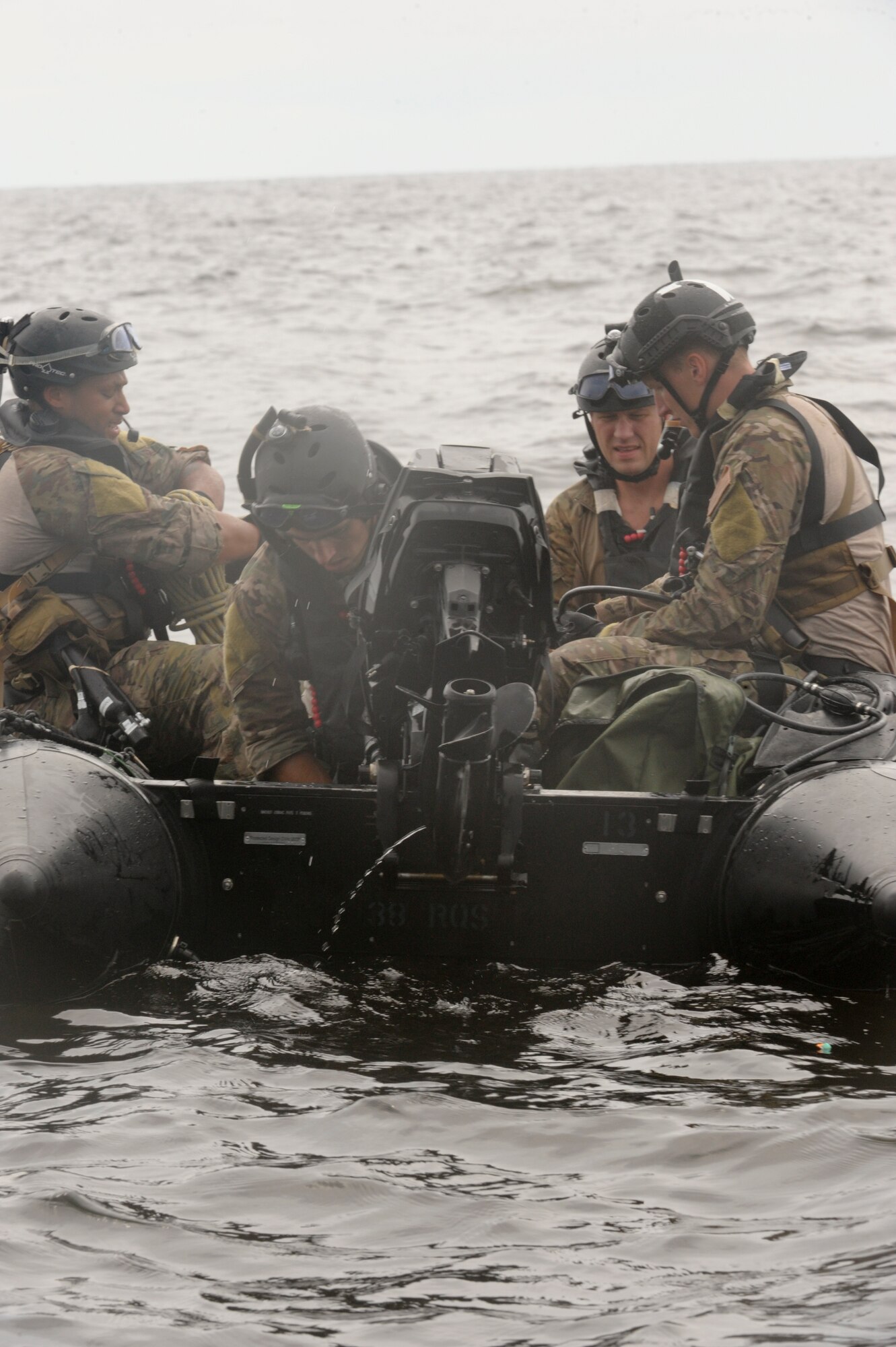 A team of pararescuemen, from the 38th Rescue Squadron at Moody Air Force Base, Ga., set up a Zodiac F470 watercraft prior to rescuing a downed pilot during a water rescue exercise in the Gulf of Mexico. The team and boat were deployed from an HH-60 Pave Hawk, and upon reaching the downed personnel the team can make the decision to have the aircraft pick them back up or to drive into shore on the watercraft. (U.S. Air Force photo by Staff Sgt. Joshua J. Garcia/Released)
