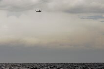 An HH-60 Pave Hawk from the 41st Rescue Squadron at Moody Air Force Base, Ga., searches the Gulf of Mexico for downed personnel during a water rescue exercise Aug. 14, 2012. Airmen from both the 41st RQS and 38th RQS worked to locate and rescue downed personnel. (U.S. Air Force photo by Staff Sgt. Joshua J. Garcia/Released)