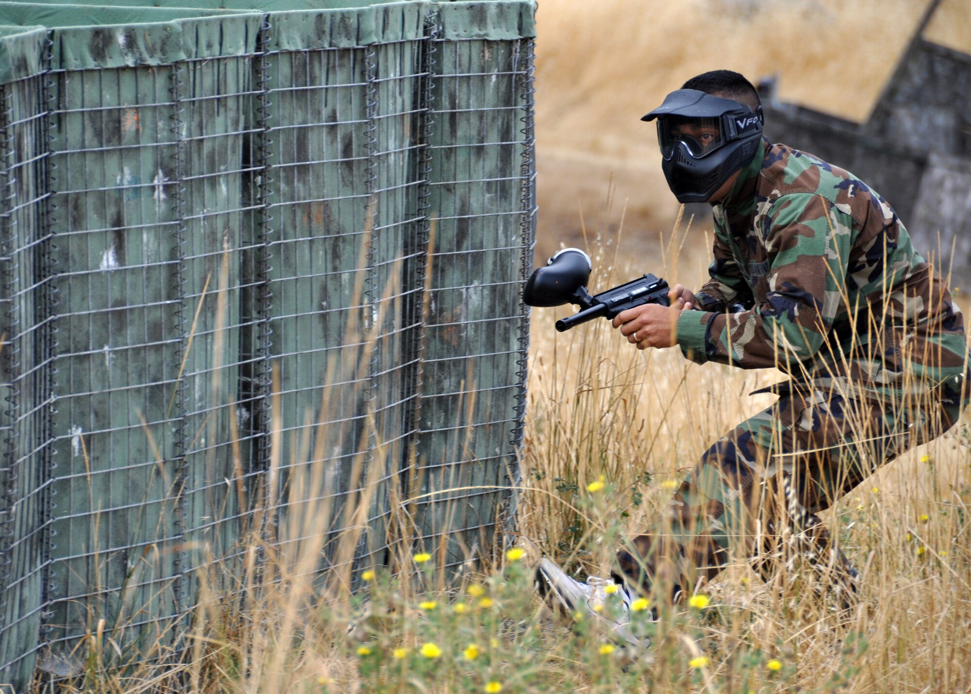 A junior officer with the U.S. Air Force Reserve maneuvers during a game of paintball Aug. 4, 2012, at Travis Air Force Base, Calif. The paintball game was a teambuilding activity for the Reserve officers attending a 4-day Junior Officer Leadership Development course. (U.S. Air Force photo by Staff Sgt. Dan Harrington)
