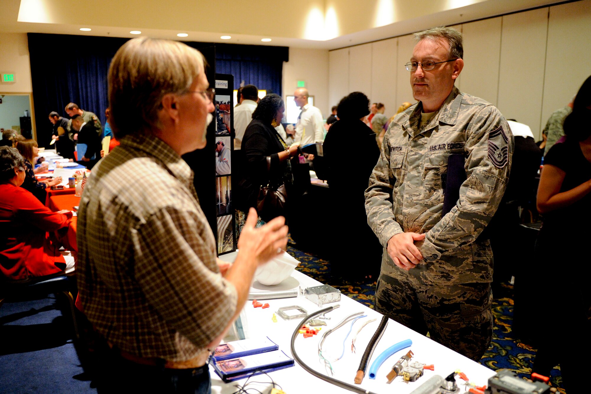 VANDENBERG AIR FORCE BASE, Calif. -- Senior Master Sgt. Duke Dutkevitch, the 1st Air and Space Test Squadron superintendent, talks about an apprenticeship electrician program at the 2012 Vandenberg Job Fair at the Pacific Coast Club here Wednesday, August 15, 2012. The fair had 27 prospective employers and was open to Active Duty military, Reservist, National Guard, Department of Defense civilians, contractors, retirees and family members. (U.S. Air Force photo/Staff Sgt. Levi Riendeau)

