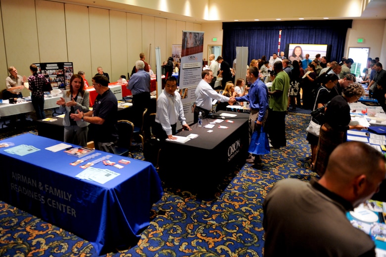 VANDENBERG AIR FORCE BASE, Calif. -- Team V members check out displays at the 2012 Vandenberg Job Fair at the Pacific Coast Club here Wednesday, August 15, 2012. The fair had 27 prospective employers and was open to Active Duty military, Reservist, National Guard, Department of Defense civilians, contractors, retirees and family members. (U.S. Air Force photo/Staff Sgt. Levi Riendeau)
