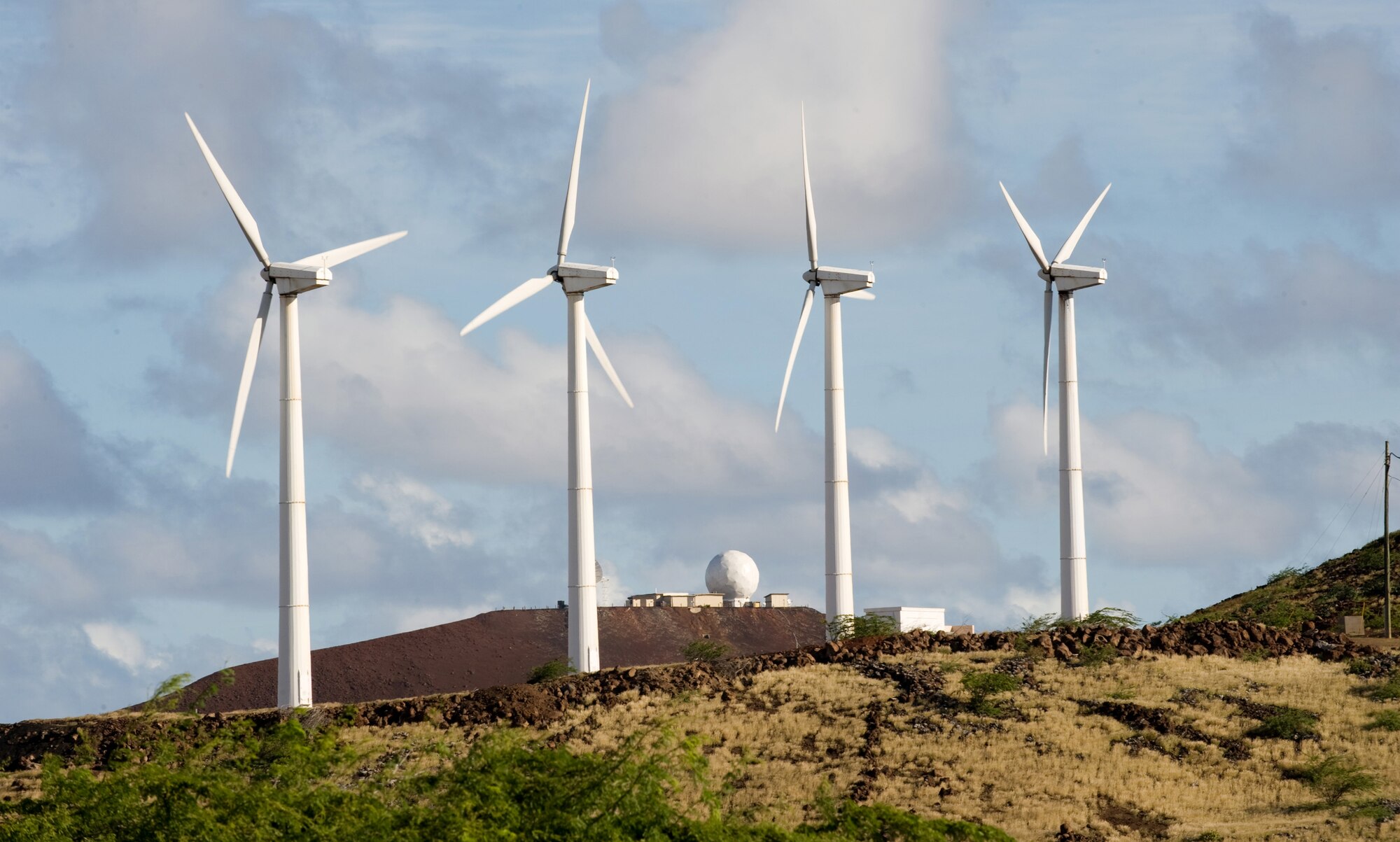 ASCENSION ISLAND, St. Helena -- Ascension Island, isolated in the middle of the south Atlantic, is a small, remote island with no access to supplies other than by ship. To preserve fuel supplies, the island uses alternative energy sources such as wind turbines to capture natural renewable energy sources. Four 225-kilowatt wind turbines help produce power for Ascension Auxiliary Airfield, a small base belonging to Air Force Space Command's 45th Space Wing.  (Courtesy photo)