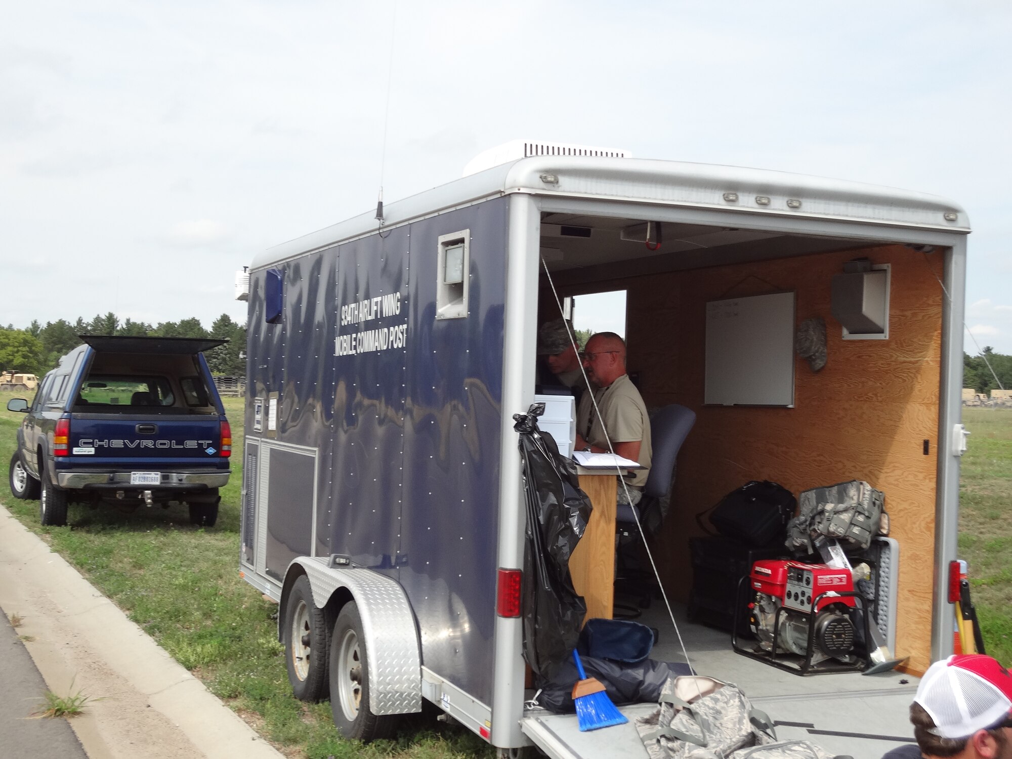 Tech. Sgt. Mike O'Brien, 934th Communications Squadron, sets up a remote computer access point in the 934th Mobile Command Post at Camp Ripley, Minn. Communications capability was tested during a 934th Airlift Wing Major Accident Response Exercise Aug. 15. (Air Force Photo/Paul Zadach)