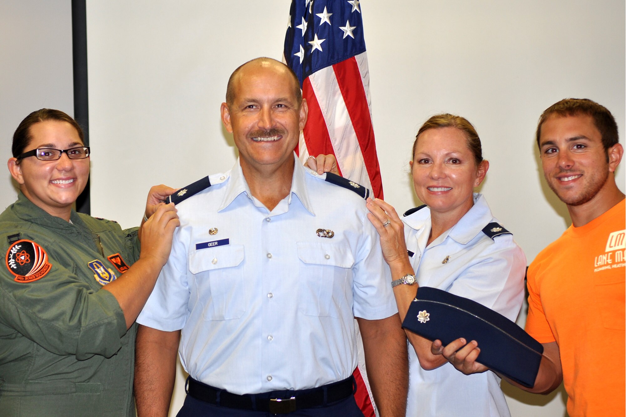 U.S. Air Force Lt. Col. Mark Geer and family are all smiles following a pinning-on ceremony held on Aug. 13, 2012, Barksdale Air Force Base, La. Geer is the Deputy Commander for the 307th Mission Support Group and was recently promoted to Lt. Col. (U.S. Air Force photo by Betty Stephens/Released)