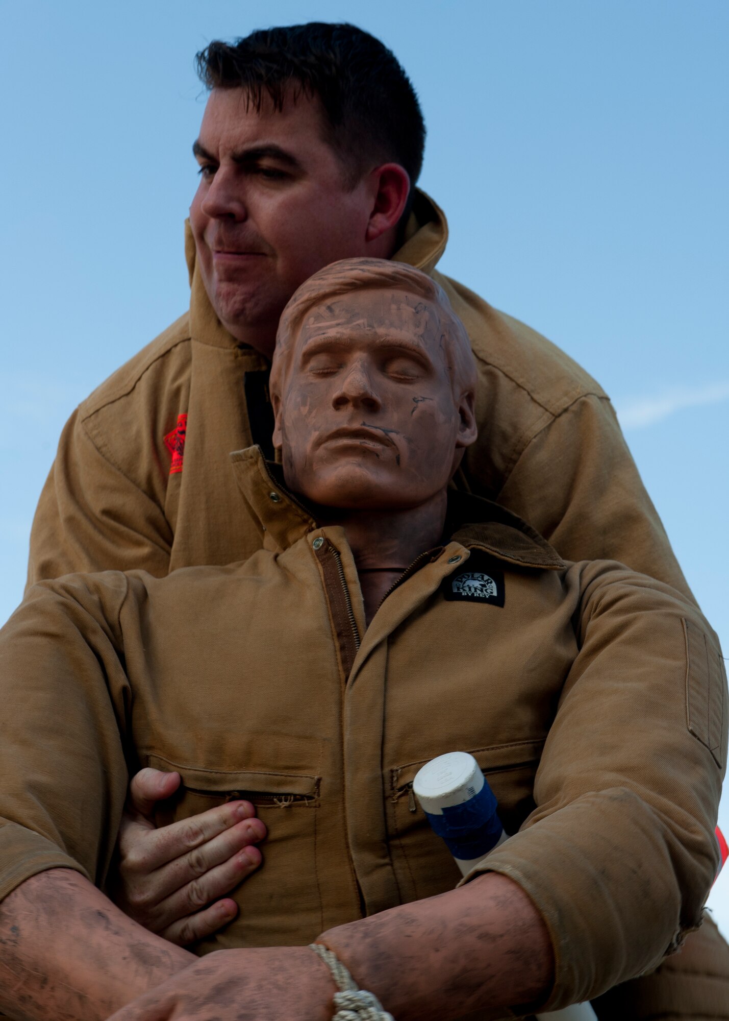 Senior Master Sgt. Matthew McQuaig, 633rd Civil Engineer Squadron deputy fire chief, hoists a 175-pound mannequin during a practice team-relay, Aug. 14, 2012, at Langley Air Force Base, Va. Teams that place at the regional events qualify for the national challenge, with the winning teams from that tier moving on to the world Firefighters Combat Challenge. (U.S. Air Force photo by Airman 1st Class R. Alex Durbin/Released)