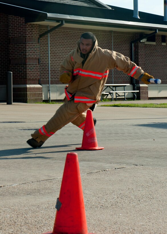 Airman 1st Class Chrisili Villasenor, 633rd Civil Engineer Squadron firefighter, runs the cone slalom during the last Fire Fighter Challenge team practice, Aug. 14, 2012, at Langley Air Force Base, Va. The team hopes to qualify for the national challenge, which annually attracts hundreds of fire departments from more than 25 locations, and is expanding to countries around the world. (U.S. Air Force photo by Airman 1st Class R. Alex Durbin/Released)