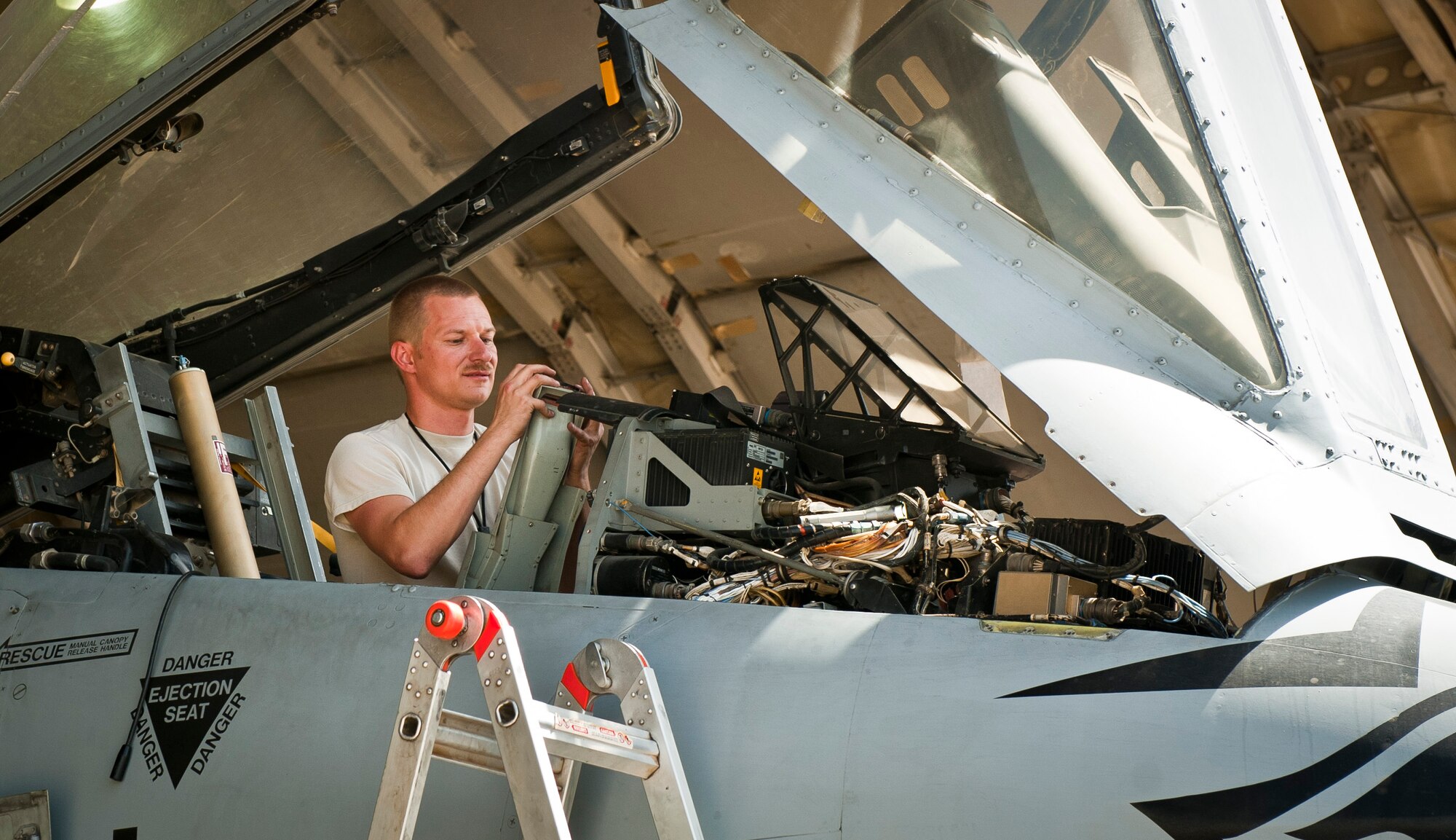 TSgt Robert Haag, an aircraft phase maintenance specialist with the 455th Expeditionary Maintenance Squadron, works in the cockpit of a U.S. Air Force A-10 Thunderbolt II during phase maintenance at Bagram Airfield, Afghanistan, August 9, 2012. The Airmen adhere to a strict schedule of maintenance to keep Bagram’s aircraft safe and operational. (U.S. Air Force Photo/Capt. Raymond Geoffroy)
